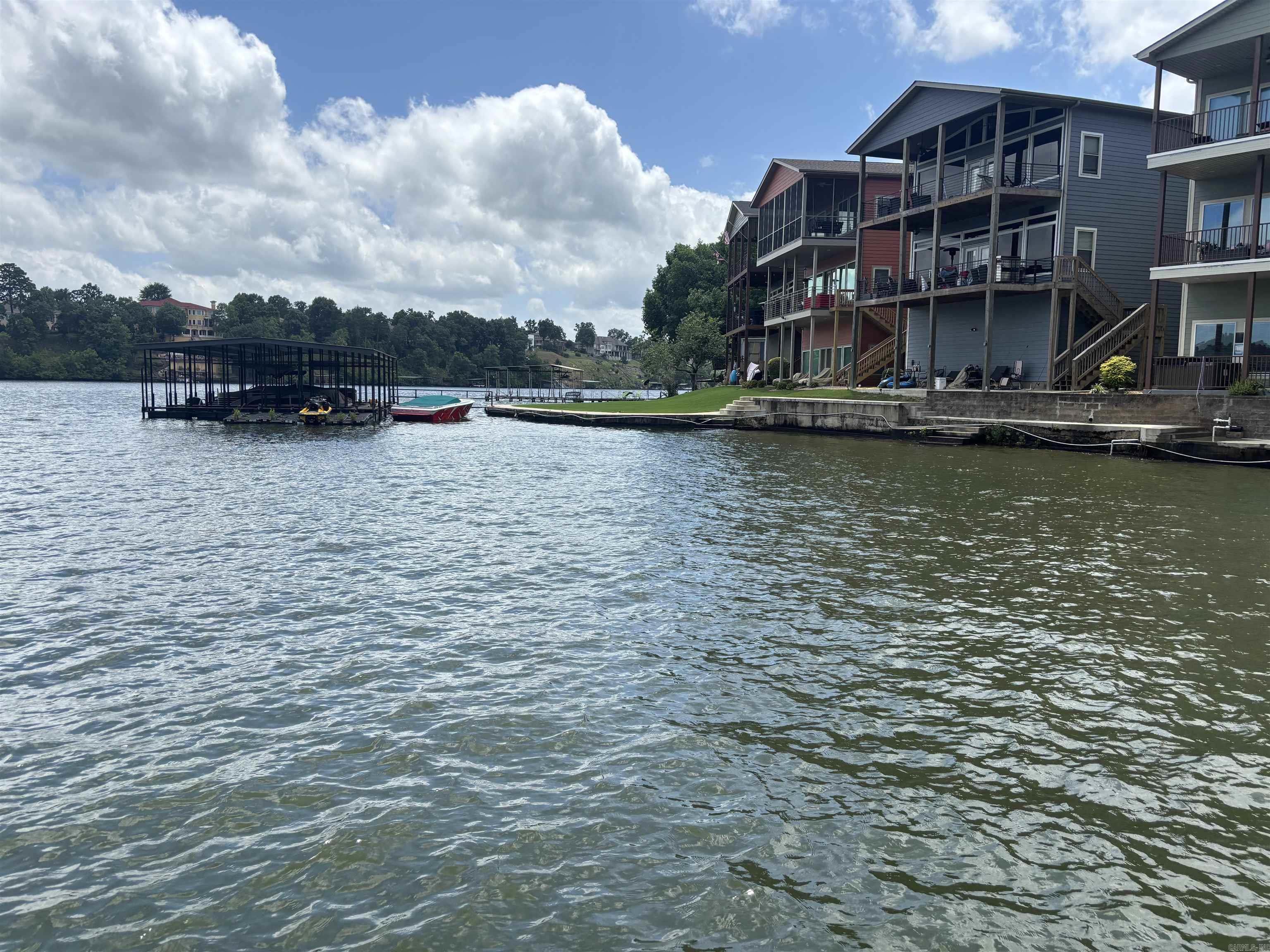 WOW!!   INVESTORS TREAT!!! 2 Lake Properties come completely furnished each property has a hot tub and decks. 100 feet on Lake Hamilton. With Covered Boat Dock. These are functioning STR'S so will need to call to show. First house is 2 bd 1 bath. The 2nd home is 2 bed 2 bath . Also a very large storage. Kayaks also convey  These homes would make a great family retreat as well