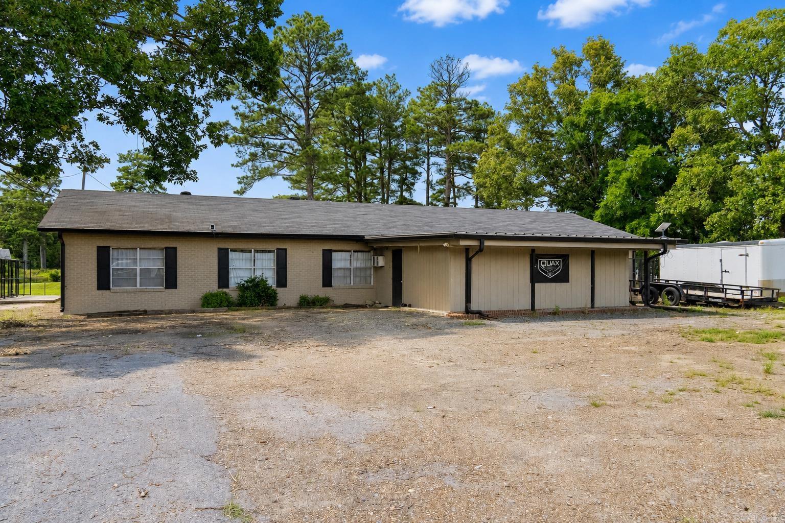QUAX Waterfowl Property is a turnkey 70.44± acre recreational property in Monroe County, Arkansas, thoughtfully developed for waterfowl hunting, outdoor recreation, and group accommodations. The remodeled 3,800± sq. ft. lodge features six bedrooms, three bathrooms, two living areas, a spacious kitchen with granite countertops, and a functional mudroom for organizing hunting gear. The property also includes ten full-hookup RV sites, dog kennels, and outdoor gathering areas, making it well suited for hunting clubs, corporate retreats, or private recreational use. Property features include an irrigated duck impoundment, natural flooded habitat along Cypress Creek, additional duck holes, three duck blinds, an irrigation well, and water-control infrastructure. Located in a region known for seasonal waterfowl migration and excellent white-tailed deer hunting, the property also includes lodge furnishings, a Polaris Ranger, trailers, decoy inventory, hunting equipment, and additional assets to be inventoried prior to closing. Optional purchase of the established QUAX, LLC business is available separately.  See agent remarks for more details about the property!