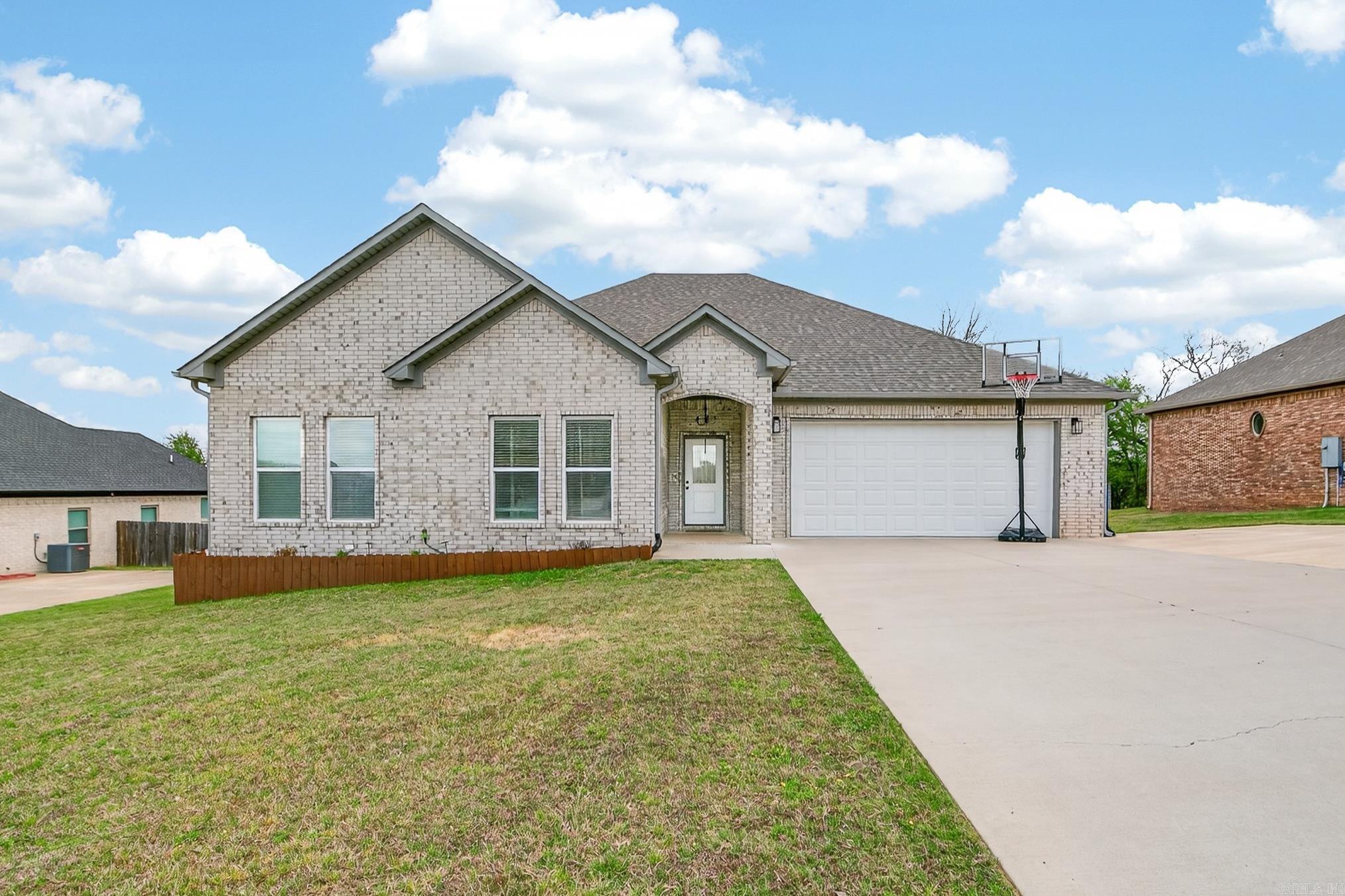 Welcome to your dream home in the coveted Greystone Subdivision in Cabot! This move-in ready 4-bedroom, 3-bathroom residence is conveniently located near the subdivision's back entrance, offering both privacy and easy access. The home boasts an open floor plan, with the primary bedroom thoughtfully separated from the additional bedrooms to ensure peace and tranquility. The modern kitchen is a chef’s delight, featuring sleek stainless steel appliances and a generously sized island perfect for meal preparation and casual dining. The primary bathroom is a luxurious retreat with a walk-in tiled shower, a large freestanding tub, and separate vanities for added convenience. Step outside to find a covered deck ideal for entertaining or relaxing, along with an exterior storage room for all your organizational needs. This home offers a perfect blend of comfort, style, and functionality in a highly desirable location.