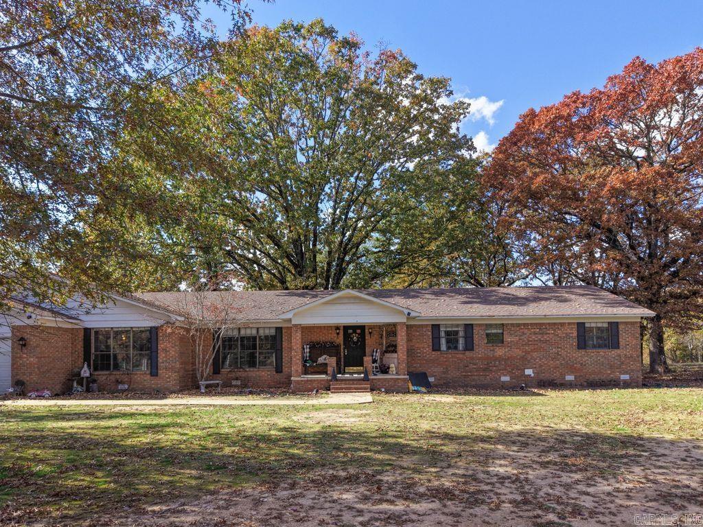 Highly Motivated seller in Bismarck School District! Two homes on one property! Would be perfect for in-laws or short term rental!! Fullyfenced with gates on approx 4 acres. Brick home is approx 3261 sq ft, 3 bedrooms, 2 1/2 baths, very large kitchen with 2 sinks, bar and an office off of the kitchen, large dining room, two large living rooms, and large laundry room. Smaller home is approx 1146 sq ft,3bedroom, 1 bath, COMES FULLY FURNISHED, beautiful hardwood floors, top on septic and pipes replaced in 2023. Outside HVACunits are 6 months old. Homes have separate water meters and electric bills. Agents see remarks