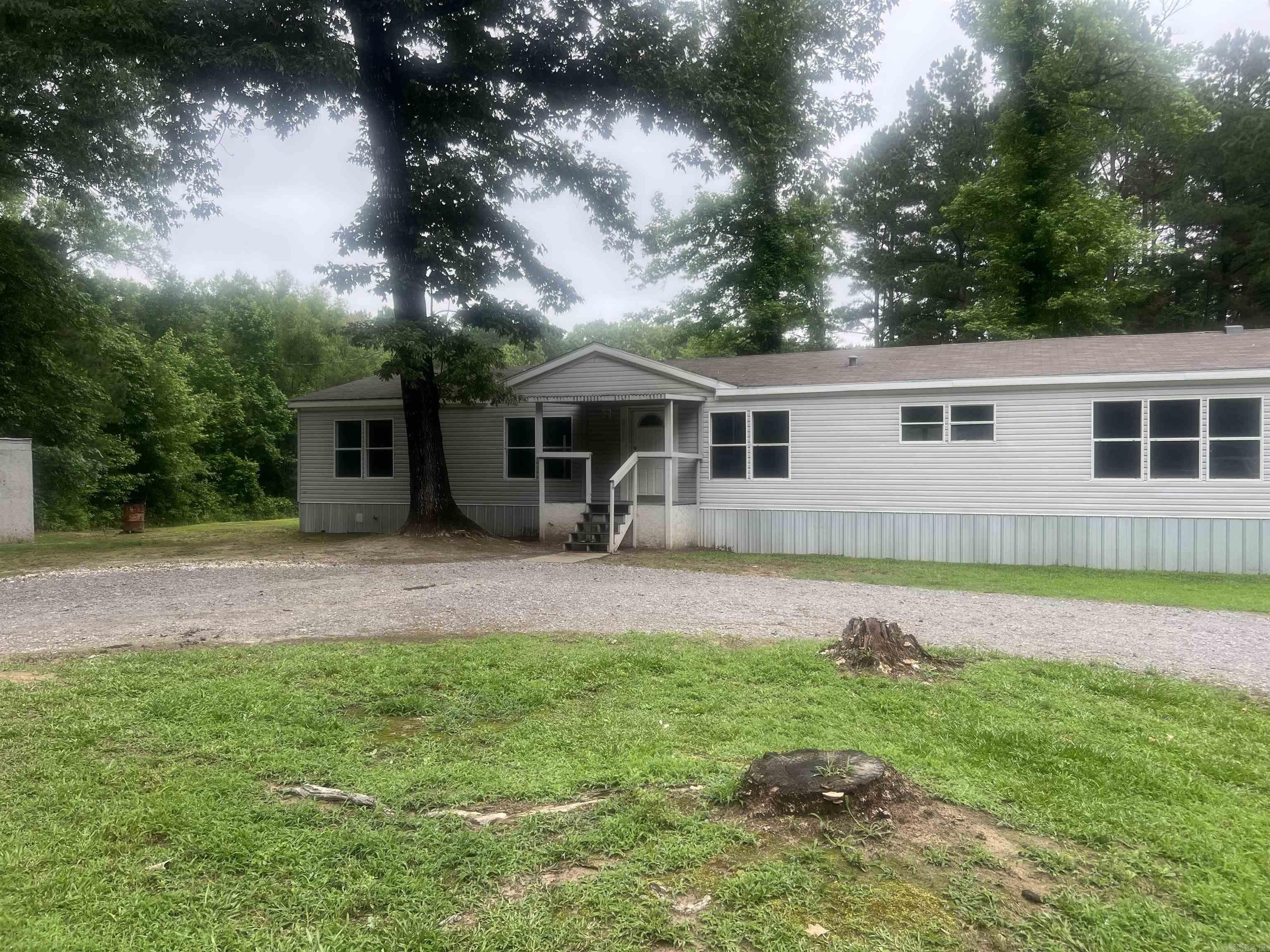 If you’ve been dreaming of a little elbow room and country living, this might be your spot. Sitting on 6.16 acres, this mobile home with a permanent foundation certificate has already had several major updates completed, including a roof in 2024, skirting in 2024, updated flooring, and fresh paint. Plenty of space for animals, a garden, bonfires, four-wheelers, or just enjoying some peace and quiet under the trees. Affordable acreage with room to make it your own!