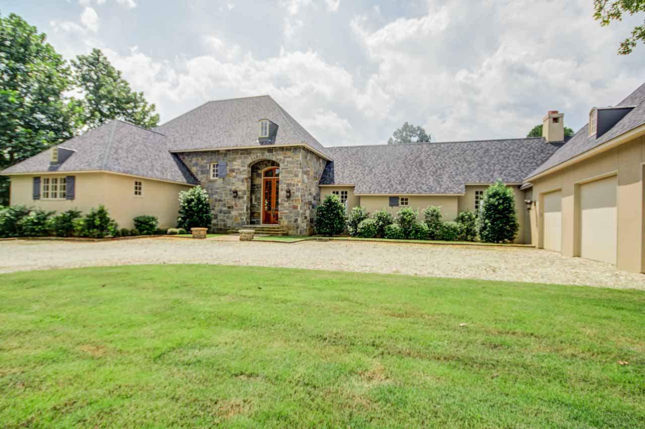 Unbelievable Jack Hartsell custom build home. Sitting on a very private 10 acres with view of spring fed lake. Beautiful site finished wood floors, hand crafted windows and doors. Master features his and her closets and bathrms.  Wonderful library off master, extensive trim and attention to detail throughout.  Hearthrm off the fabulous open kitchen with gorgeous marble tops, built in refrigerator and huge pantry.  17'x17' safe room/wine cellar on lower level with heat and air, 3 car 1000sf garage.