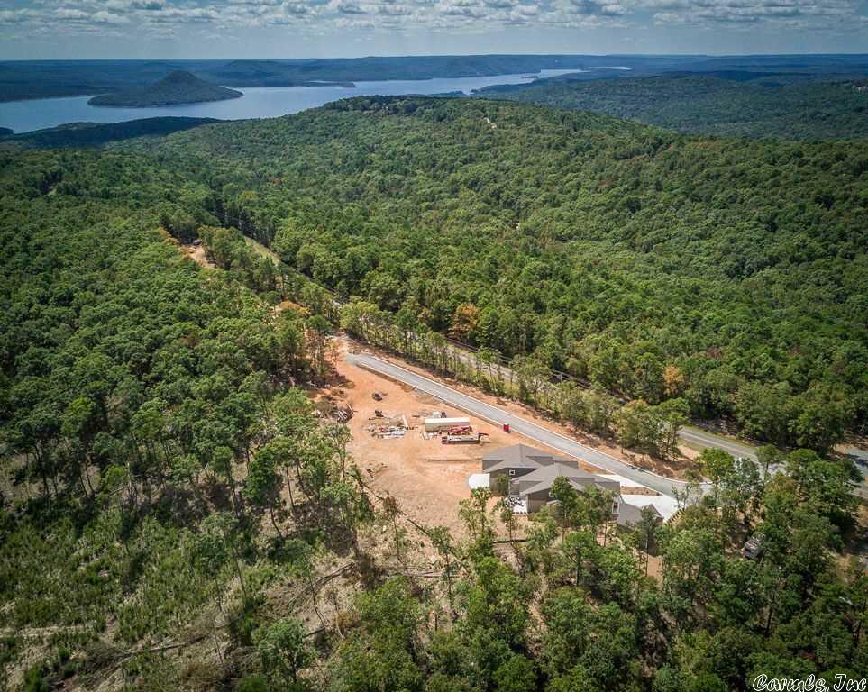 Panoramic views of Greers Ferry Lake from the Osage Point development offering custom townhomes, vacant lots, & a library of floor plans from the builder (Ozark Resort Homes) or bring your own floorplan! Lake view lots include water extension, gravity sewer, underground electrical extension & phone.  121B extends across the street for space for Toy Garage!  Ask for complete list of lots & prices; lots can be purchased in 'bundled' groups.  Seller to provide new survey.   Choose yours & begin Resort Living!!