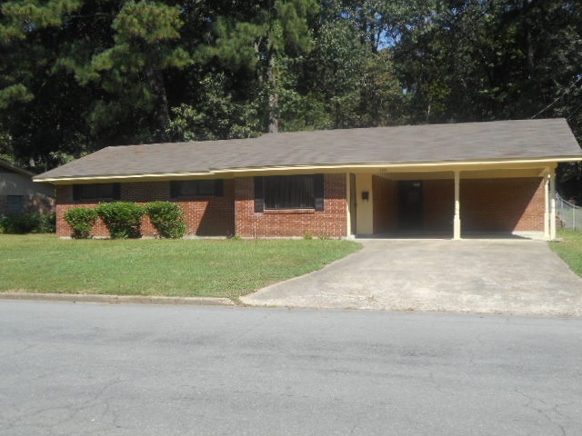 Updated interior! Move in ready! 3 BRs, 2 Baths, new carpet, fans/lighting, blinds. Updated kitchen. Stainless refrigerator, new wall oven, smooth surface counter range, dishwasher, counter tops, etc. Sliding patio door leads to a big back yard, some fencing in back yard. Eat-at bar. Eat-in kitchen/living area w/laminate flooring & tile in kitchen. Lg. laundry room. HVAC 2 yrs old. New roof. Alarm. 2-Car Carport. Don't miss this one!!!