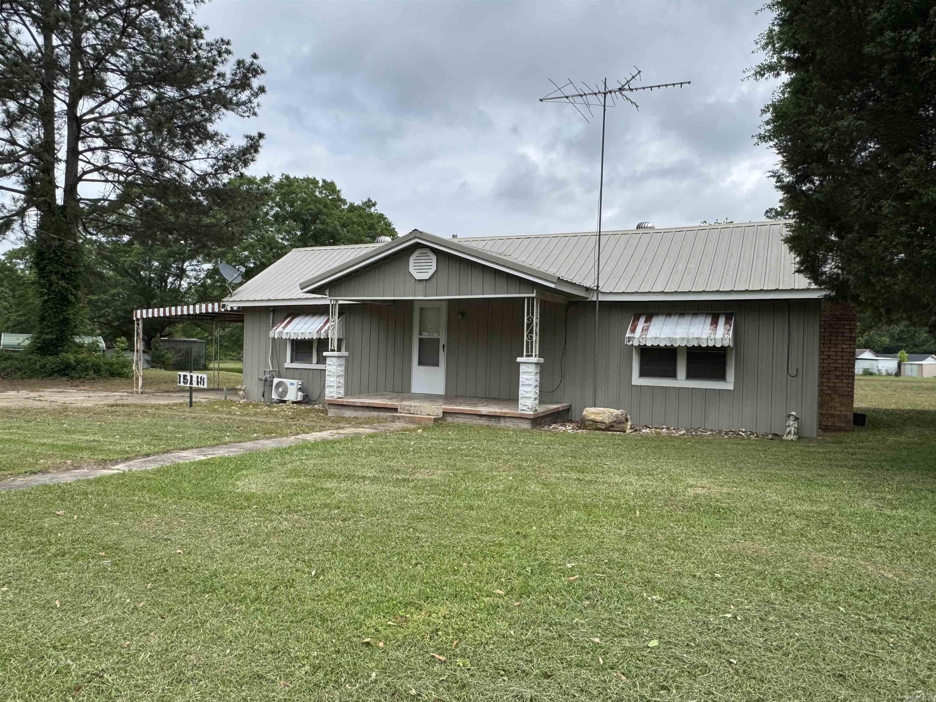 Large 2 acre lot close to town.  This property offers solid wood floors, large dining, living room with wood burning fireplace.  Some upgrades throughout the home.  Lot offers an outbuilding with interior space as well as lean-to space for mowers.  Circle Drive makes for easy in and out of property.   See associated documents for full legal.  AGENTS see the agent remarks