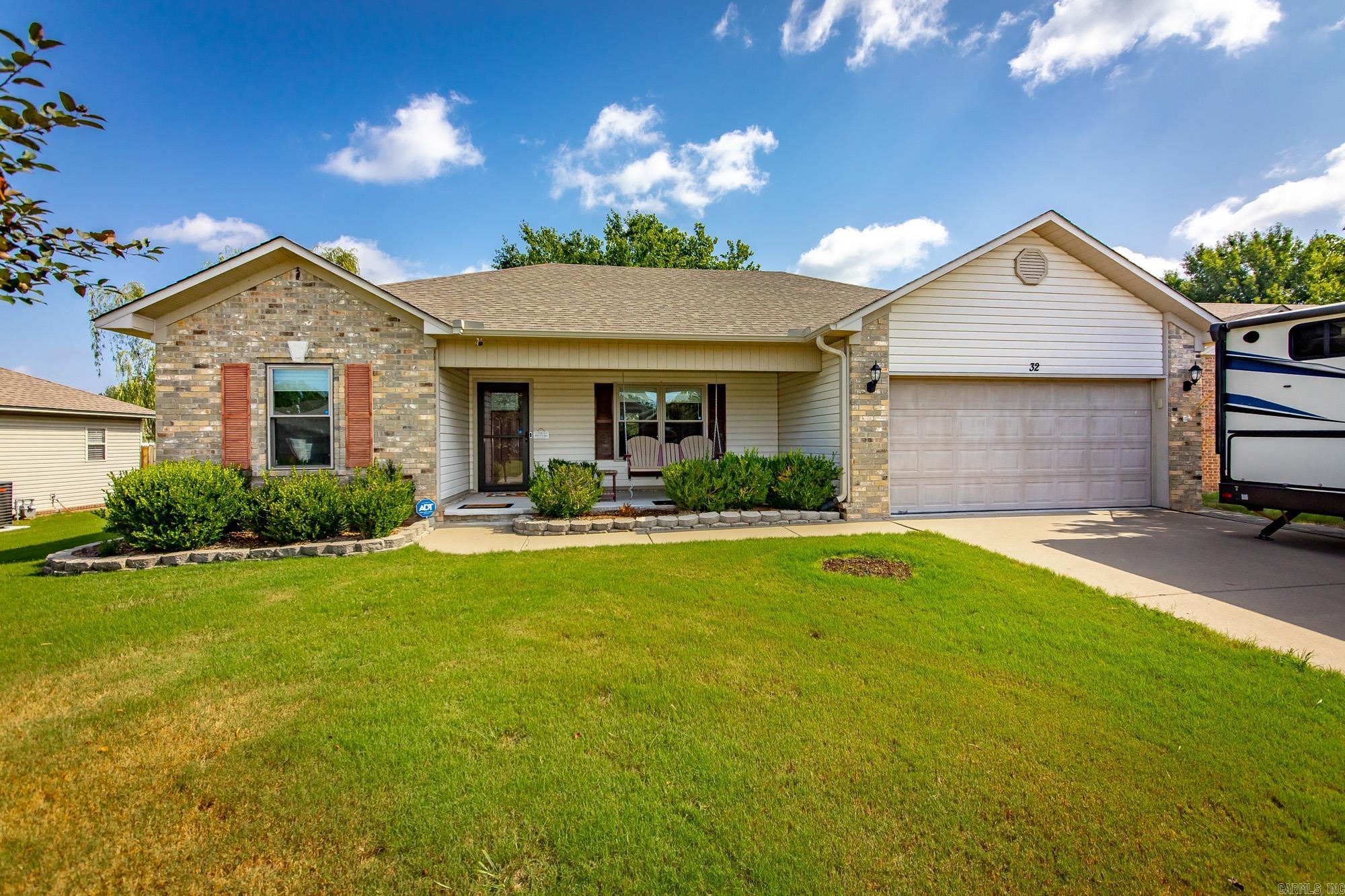 Adorable & Move-In Ready! This beautifully maintained 3-bedroom, 2-bath home is packed with updates, including newer windows, doors, HVAC, fence, gutters, lighting, faucets, switches, USB/night-light outlets, appliances, and so much more! The spacious living room features a stunning double tray ceiling, cozy fireplace, and gorgeous wood flooring. The kitchen offers abundant cabinetry, a pantry area, and newer appliances. The private primary suite boasts a tray ceiling, large walk-in closet, and plenty of room to relax. Spacious guest bedrooms provide comfort for family or visitors. Energy-efficient solar panels help keep utility costs incredibly low, with an average electric bill of around $30 per month. Step outside to enjoy the beautifully landscaped backyard with an extended patio—perfect for entertaining or relaxing. RV owners will appreciate the dedicated RV parking complete with a 110V/30-amp hookup. This move-in-ready home truly has it all!