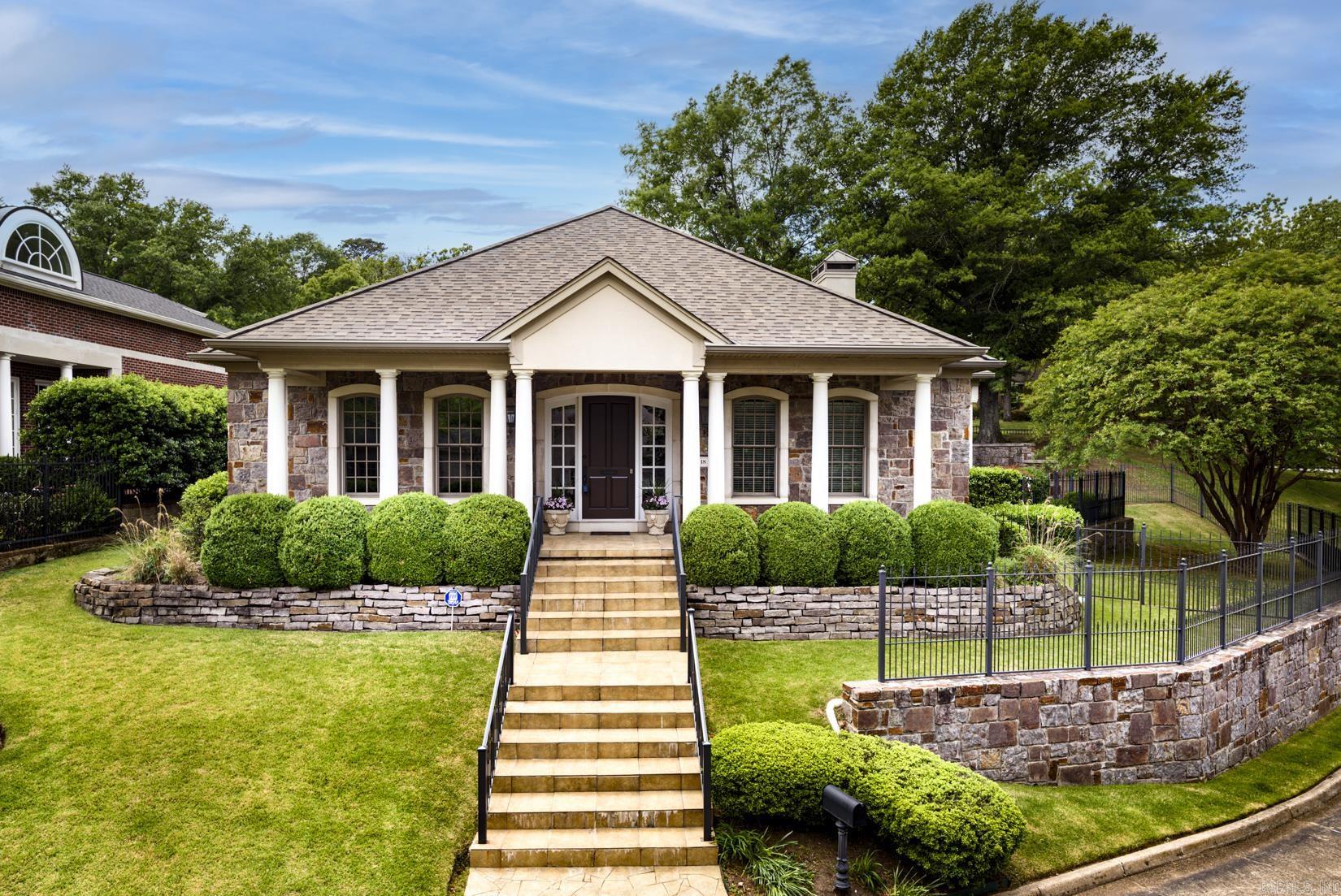 Located at the end of a quiet cul-de-sac in desirable St. Johns Place, this spacious Heights home offers exceptional curb appeal, a covered front porch, and a prime, low-maintenance lifestyle. Inside, you’ll find elegant living spaces featuring bamboo hardwood floors and a stunning limestone fireplace mantel anchoring the main living area. The thoughtfully designed main level includes a private office with built-ins, formal dining room, and a spacious primary suite. The primary retreat offers an ensuite bath with walk-in shower, jetted tub, and generous closet space. The eat-in kitchen features a breakfast bar and opens to comfortable living areas, ideal for both entertaining and daily living. The hardwood floors continue upstairs, where you’ll find three additional bedrooms, a cozy den, walk-in attic storage, and a spacious cedar-lined closet. Additional highlights include a rear-loading two-car garage, a small fenced area near the covered patio perfect for pets, and POA-covered exterior lawn maintenance for easy living. Roof replaced November 2024. A rare opportunity to own a spacious, well-appointed home in one of the Heights’ most sought-after locations. Agents, see remarks.