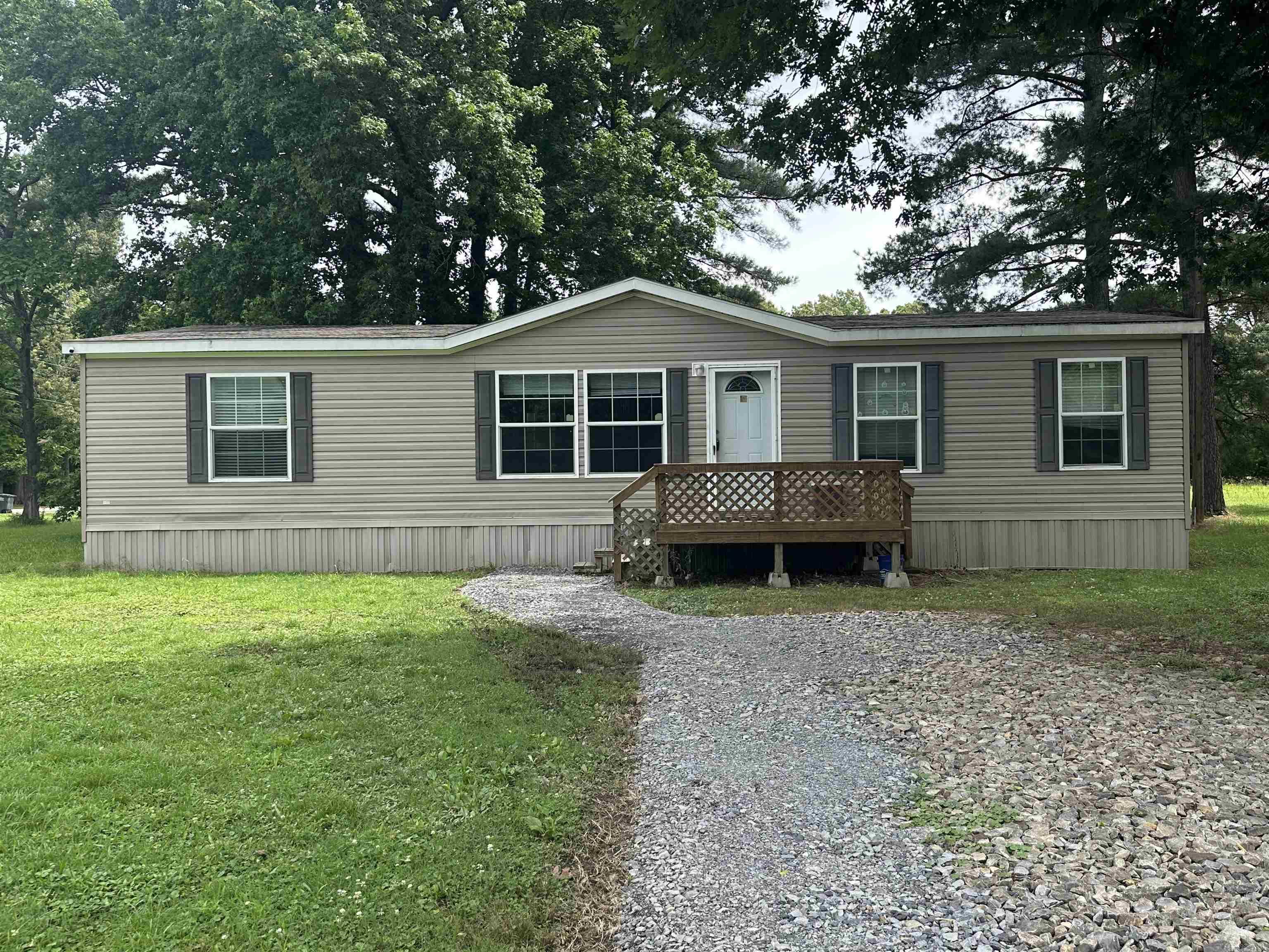 Mobile Home on a small city lot with city water and sewer.  Home is blocked up on concrete runners with necessary tie downs to qualify for multiple loan types.