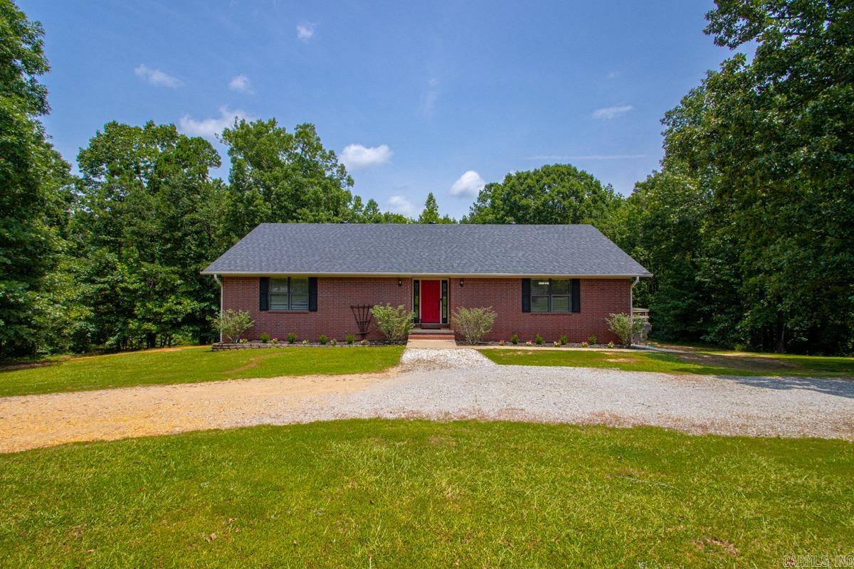 Nestled on nearly 5 acres of serene, wooded privacy within the desirable Sheridan School District, this meticulously maintained and thoughtfully updated East End property offers unparalleled space and versatility. The main level boasts an inviting, open-concept layout seamlessly connecting the kitchen, dining, and main living areas—ideal for large families and effortless entertaining—alongside four bedrooms, including one flexible space perfect for a private home office. Providing excellent potential for a separate living quarters, the walk-out basement features a spacious living area, a full bathroom, and a large closet, with direct access to both the backyard and the three-car garage. Recent high-value updates offer ultimate peace of mind, including a brand-new roof (2026), fresh paint throughout, and a newly installed upstairs heating system, complementing the well-maintained 7-to-8-year-old downstairs HVAC. Complete with a shaded side deck off the laundry room that is perfect for relaxing evening porch time, this tranquil estate beautifully balances modern comfort, functional design, and natural seclusion.