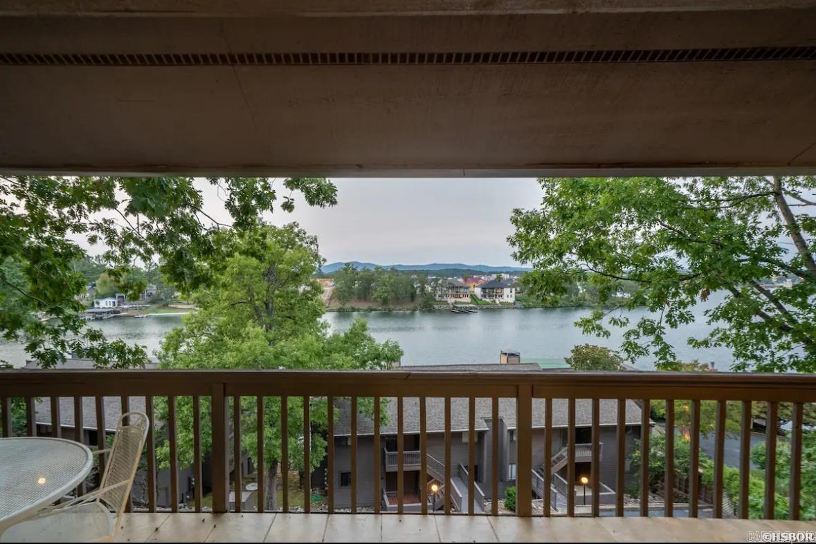 Newly remodeled 2BR/2BA condo on Lake Hamilton. Entry-level unit with no steps! All furniture, furnishings and contents convey to the new buyer.  The condo has a beautiful wood burning fireplace and an expansive balcony overlooking the lake.  The condo also has a strong track record as a short term rental with very good reviews on Airbnb! Local management in place.  Located in the gated community of South Shore with amenities that include a swimming pool, hot tub and tennis court(s).