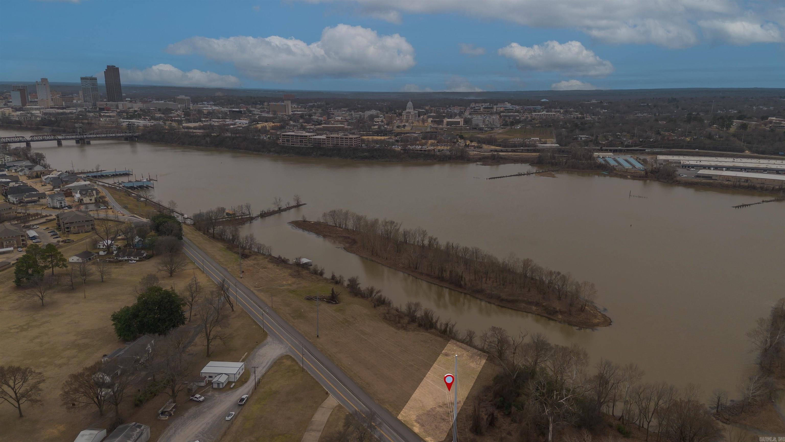 Discover the perfect chance to own 0.56 acres of stunning riverfront property in North Little Rock. With breathtaking views and direct access to the Arkansas River, this lot offers endless possibilities. Whether you’re looking for a private retreat, recreational getaway, fishing spot, or investment opportunity, this property provides a rare chance to enjoy waterfront living.  Conveniently located off River Rd, this lot offers easy access to shopping, dining, and major roadways while still providing the tranquility of a scenic riverside setting. Opportunities like this don’t come often—don’t miss out on this incredible piece of riverfront property! Contact us today for more details.