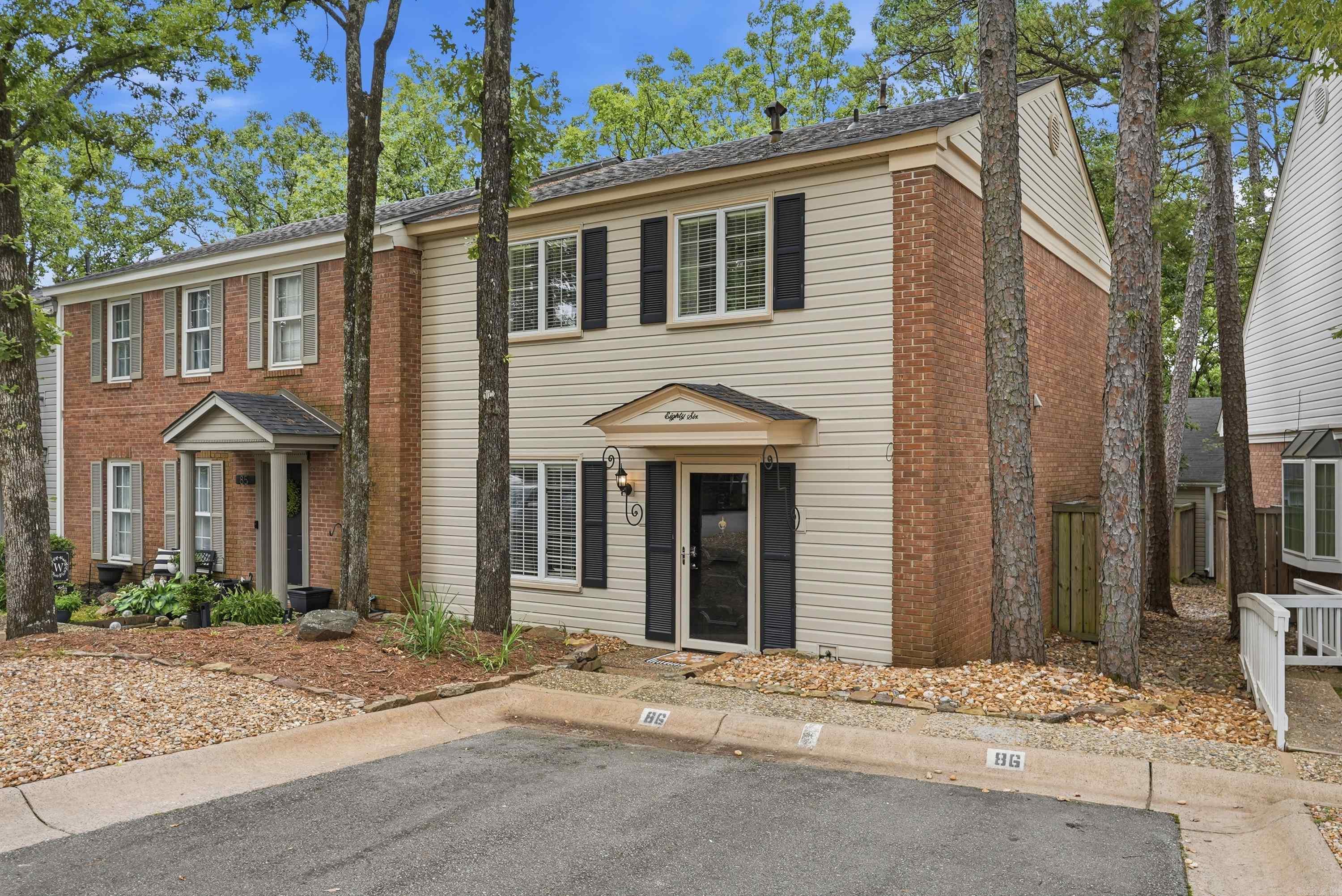 Welcome to this charming 2-bedroom, 2.5-bath townhome in the desirable Kingsbridge community which offers a prime location to restaurants, shopping and more in Little Rock while also providing community members with access to the pool and tennis courts. This unit features all new interior paint as well as all new carpet upstairs. Kitchen refrigerator will convey. Upstairs you will find a functional floor plan with both bedrooms having their own ensuite with walk in closets. Downstairs you will find a half bath and turn key living spaces along with a private patio with outside storage room. Agents read remarks.
