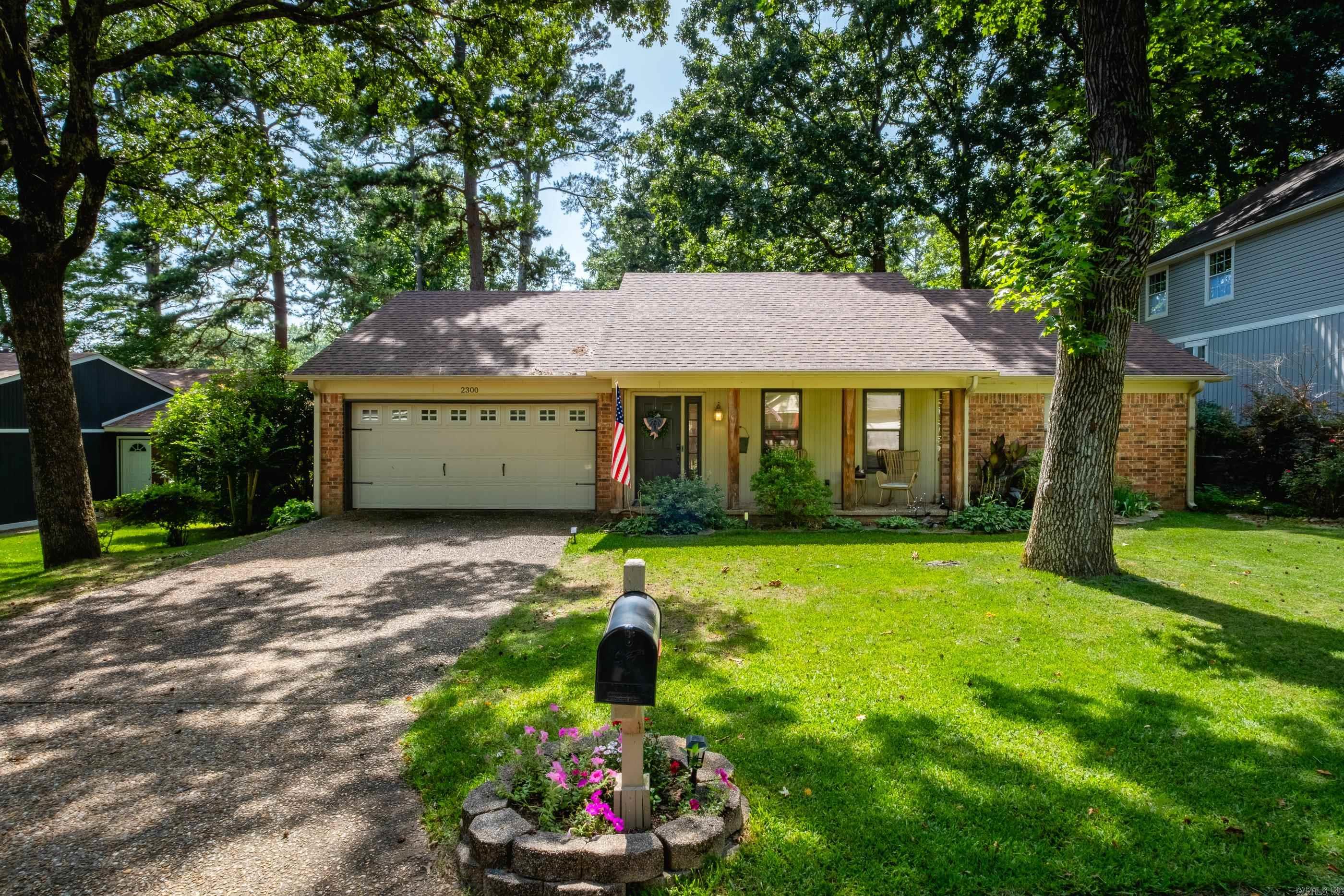 Adorable West Little Rock home just off Peach Tree Drive! Nestled on a quiet, friendly street, this charming home offers a thoughtfully designed layout where every square foot is usable with no wasted space.  The inviting living room serves as the heart of the home, featuring a cozy fireplace for relaxing evenings and beautiful views overlooking the large, fenced backyard. Step outside to enjoy the newly added pergola, creating the perfect space for lounging, entertaining, or enjoying your morning coffee.  The home also includes a spacious two-car garage and numerous thoughtful updates throughout. Both bathrooms were beautifully remodeled in 2022 with new tile and modern fixtures. All three bedrooms feature brand-new carpet, and new ceiling fans have been installed throughout the home for added comfort. A new tankless water heater was installed in 2025, along with updated dryer venting to improve efficiency.  With its functional floor plan, inviting outdoor space, and extensive updates, this move in ready home is one you won't want to miss!