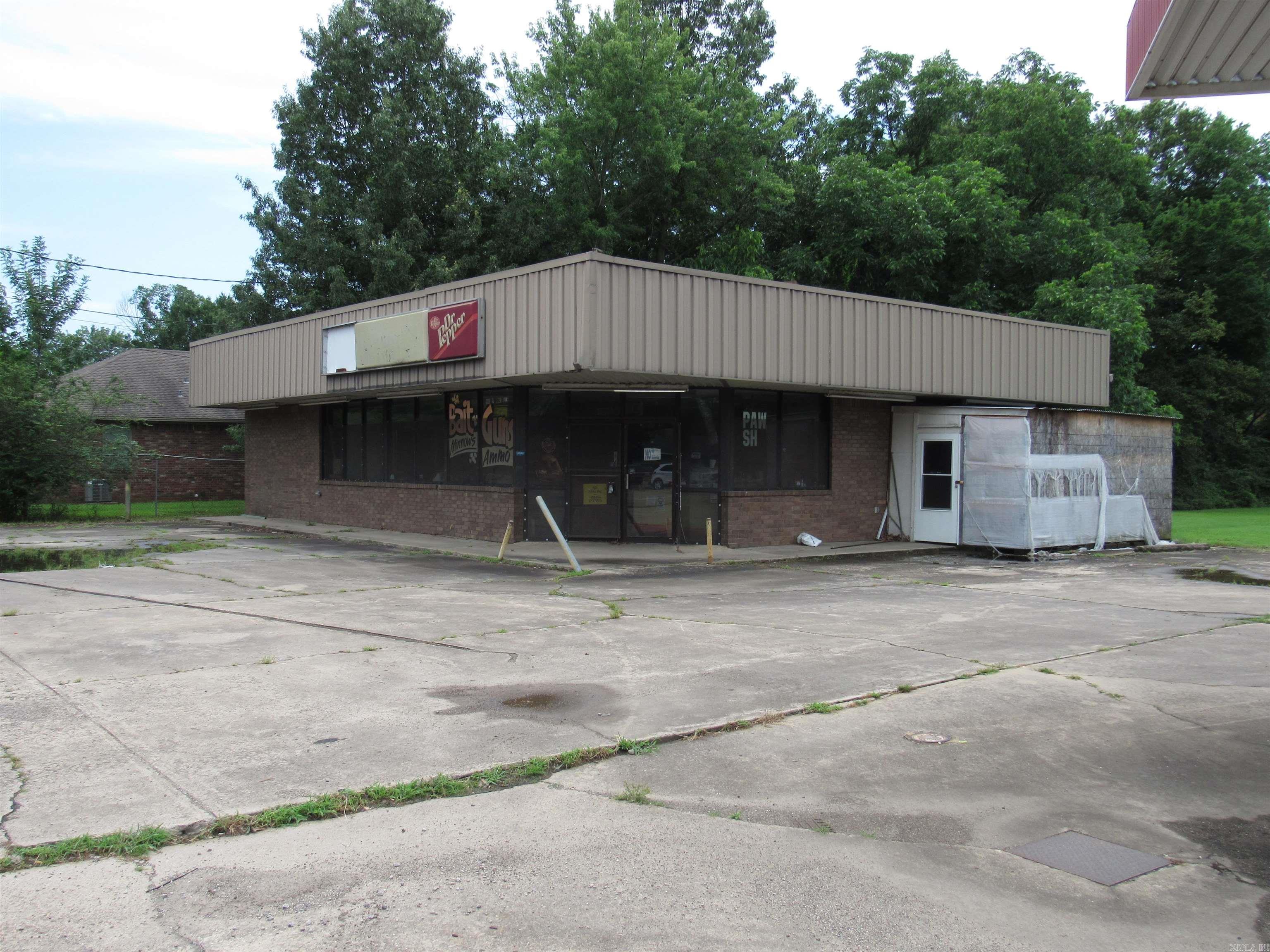 Prime Commercial location close to fairgrounds and close to many residential rooftops. Gas pumps temporarily out of use, but inspected.  TLC could make this available to plenty of options.