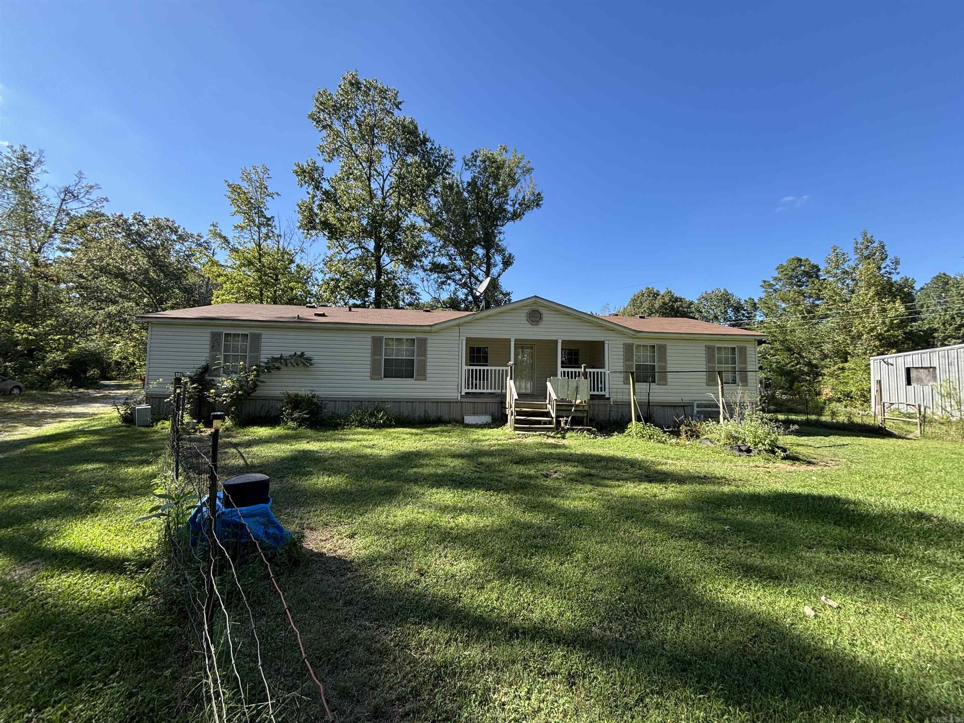 Excellent investment opportunity. Listing includes three 3 Bedroom/2 Bath properties as follows:  14130 is 1,848 sqft, built in 2005 with a wood burning fireplace. 14134 is 1,680 sqft, built in 1996 with a wood burning fireplace. 14136 is 1,536 sqft, built in 2014 and is handicap accessible. Also included on the property is a 38x50 storage building wired for 110v and 220v, a storm shelter, and 14132 is 1,176 sqft built in 1971 could possibly be rehabbed and turned into a fourth house. All of this is located on 4.99 acres with room for additional properties or just enjoying county living just outside of town.