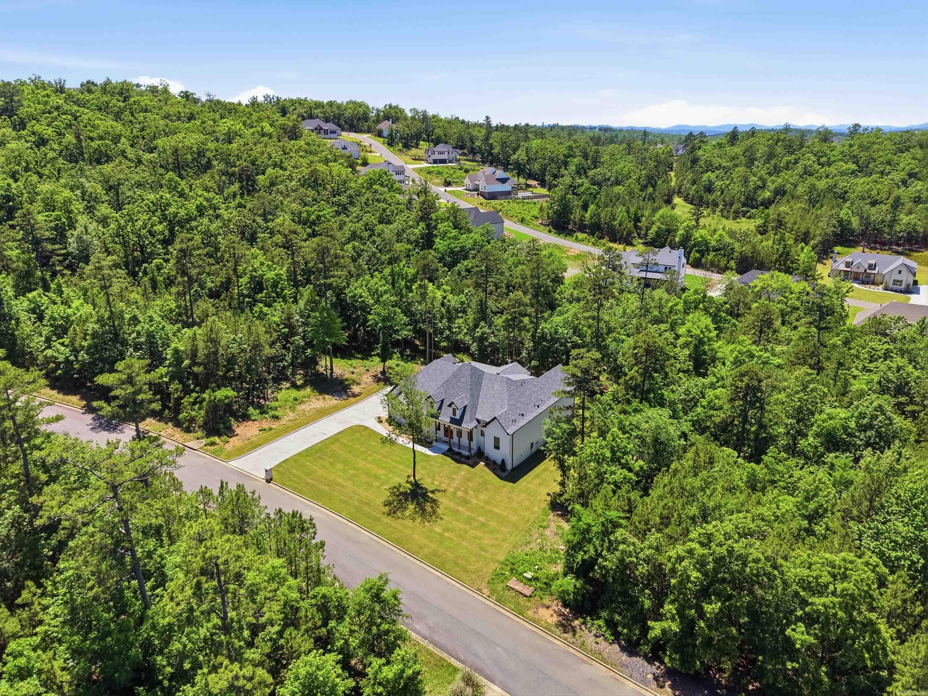 Nestled on a beautifully private homesite in the highly sought-after Waterview Estates area, this exceptional custom home offers luxury living with unmatched space, privacy, and future upside. Situated on an expansive 150’ wide lot and backing directly to designated green space, the property provides a rare sense of seclusion and natural beauty that is difficult to find.  Designed with both comfort and functionality in mind, every bedroom features its own private bathroom and walk-in closet, creating the perfect layout for family and guests alike. The home showcases quality craftsmanship, spacious living areas, and thoughtful design throughout.  An incredible bonus opportunity awaits upstairs with approximately 500 square feet already framed out and plumbing stubbed in — offering the future owner an easy path to additional living space, a game room, guest suite, media room, or home office while adding substantial equity potential.  This is a rare opportunity to own a private luxury property with room to grow!