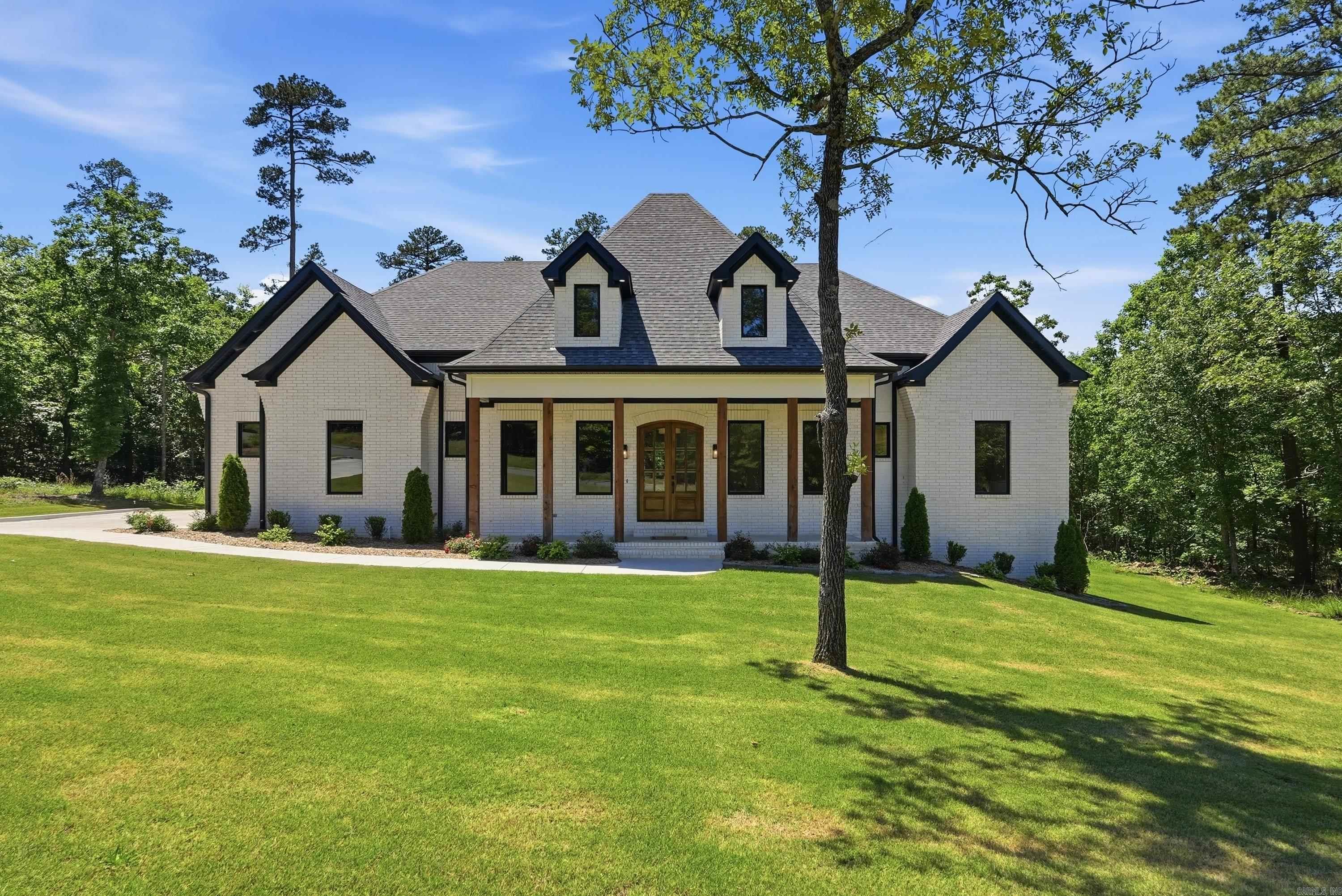 Nestled on a beautifully private homesite in the highly sought-after Waterview Estates area, this exceptional custom home offers luxury living with unmatched space, privacy, and future upside. Situated on an expansive 150’ wide lot and backing directly to designated green space, the property provides a rare sense of seclusion and natural beauty that is difficult to find.  Designed with both comfort and functionality in mind, every bedroom features its own private bathroom and walk-in closet, creating the perfect layout for family and guests alike. The home showcases quality craftsmanship, spacious living areas, and thoughtful design throughout.  An incredible bonus opportunity awaits upstairs with approximately 500 square feet already framed out and plumbing stubbed in — offering the future owner an easy path to additional living space, a game room, guest suite, media room, or home office while adding substantial equity potential.  This is a rare opportunity to own a private luxury property with room to grow!
