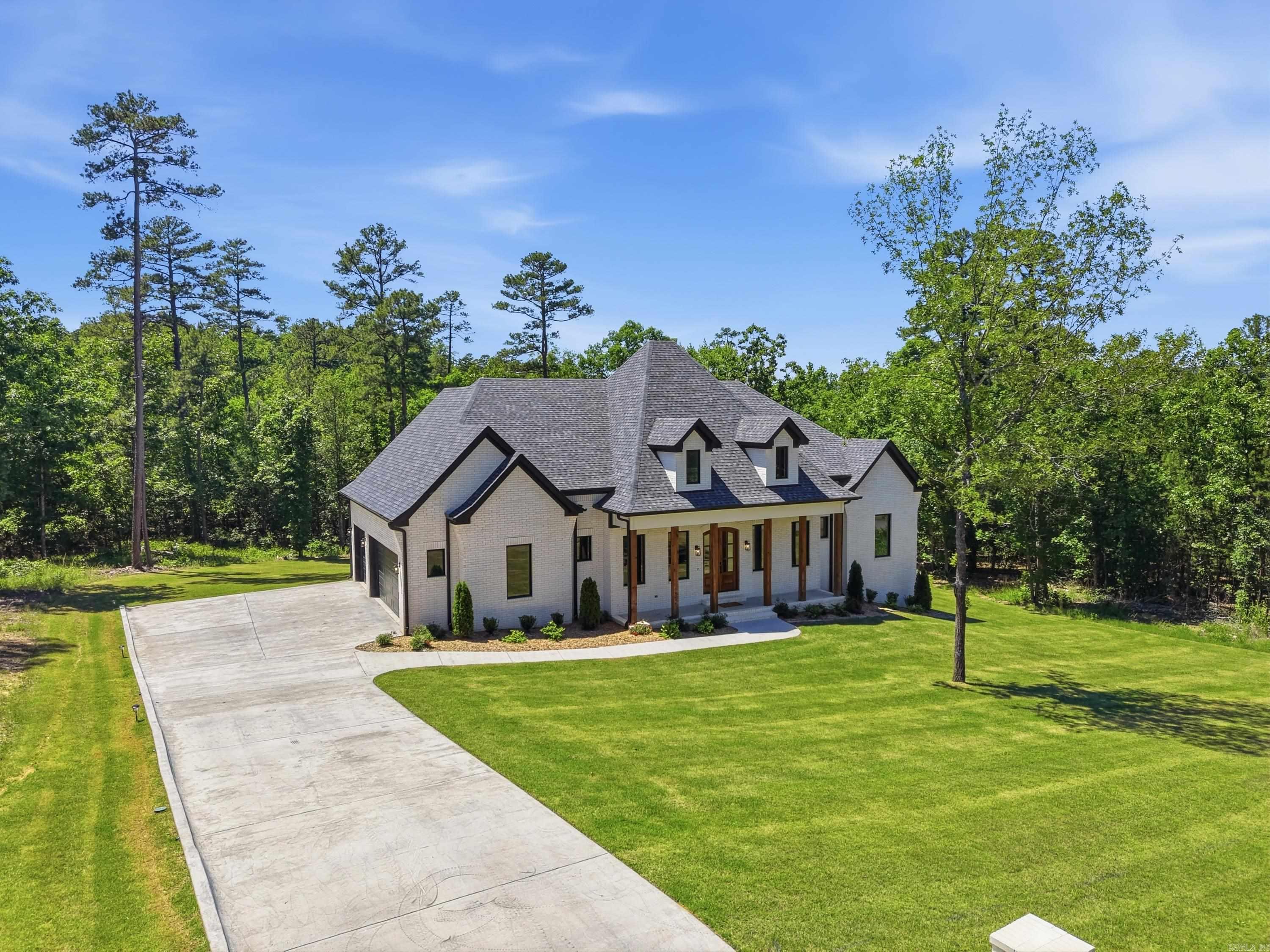 Nestled on a beautifully private homesite in the highly sought-after Waterview Estates area, this exceptional custom home offers luxury living with unmatched space, privacy, and future upside. Situated on an expansive 150’ wide lot and backing directly to designated green space, the property provides a rare sense of seclusion and natural beauty that is difficult to find.  Designed with both comfort and functionality in mind, every bedroom features its own private bathroom and walk-in closet, creating the perfect layout for family and guests alike. The home showcases quality craftsmanship, spacious living areas, and thoughtful design throughout.  An incredible bonus opportunity awaits upstairs with approximately 500 square feet already framed out and plumbing stubbed in — offering the future owner an easy path to additional living space, a game room, guest suite, media room, or home office while adding substantial equity potential.  This is a rare opportunity to own a private luxury property with room to grow!