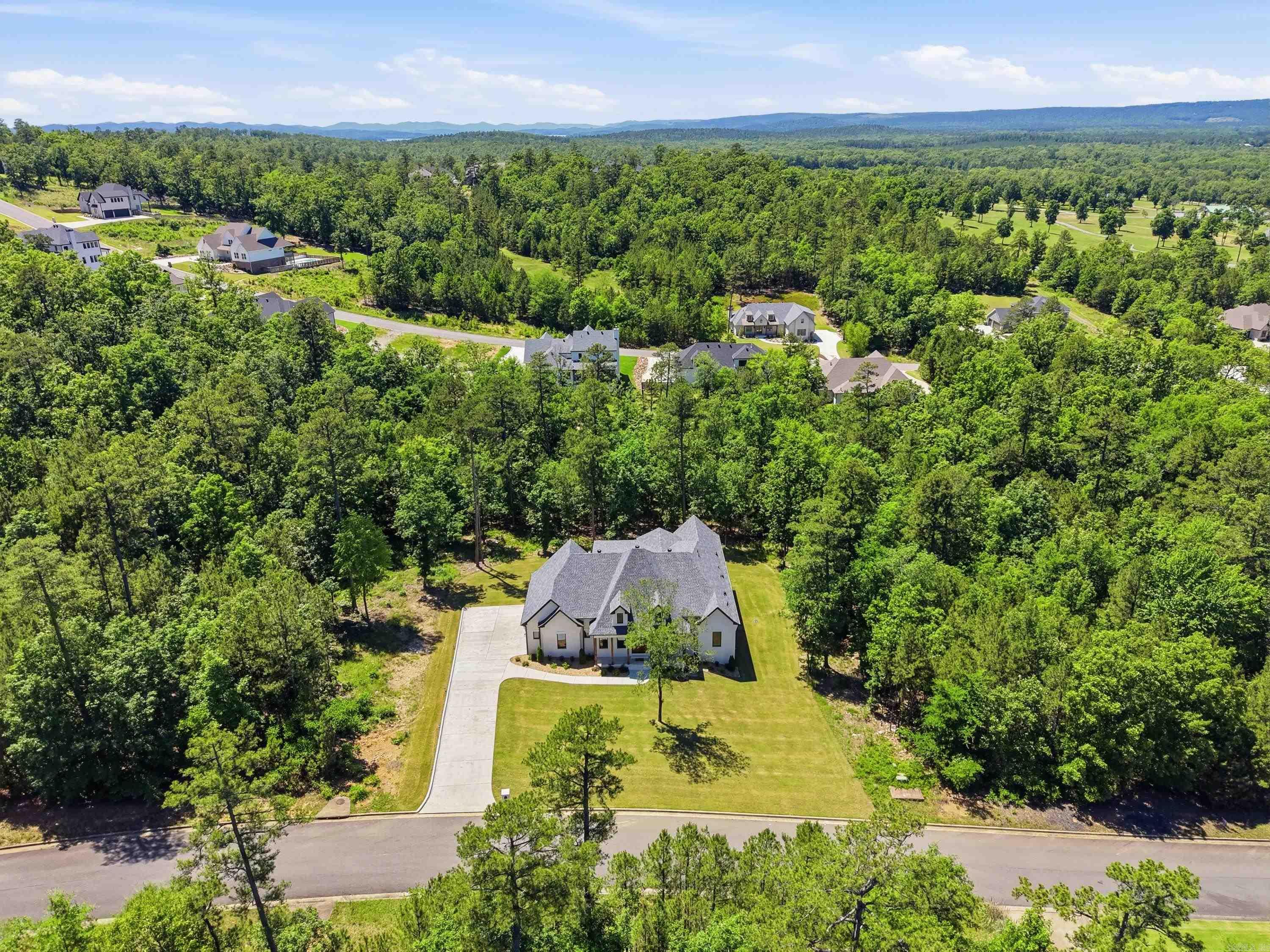 Nestled on a beautifully private homesite in the highly sought-after Waterview Estates area, this exceptional custom home offers luxury living with unmatched space, privacy, and future upside. Situated on an expansive 150’ wide lot and backing directly to designated green space, the property provides a rare sense of seclusion and natural beauty that is difficult to find.  Designed with both comfort and functionality in mind, every bedroom features its own private bathroom and walk-in closet, creating the perfect layout for family and guests alike. The home showcases quality craftsmanship, spacious living areas, and thoughtful design throughout.  An incredible bonus opportunity awaits upstairs with approximately 500 square feet already framed out and plumbing stubbed in — offering the future owner an easy path to additional living space, a game room, guest suite, media room, or home office while adding substantial equity potential.  This is a rare opportunity to own a private luxury property with room to grow!