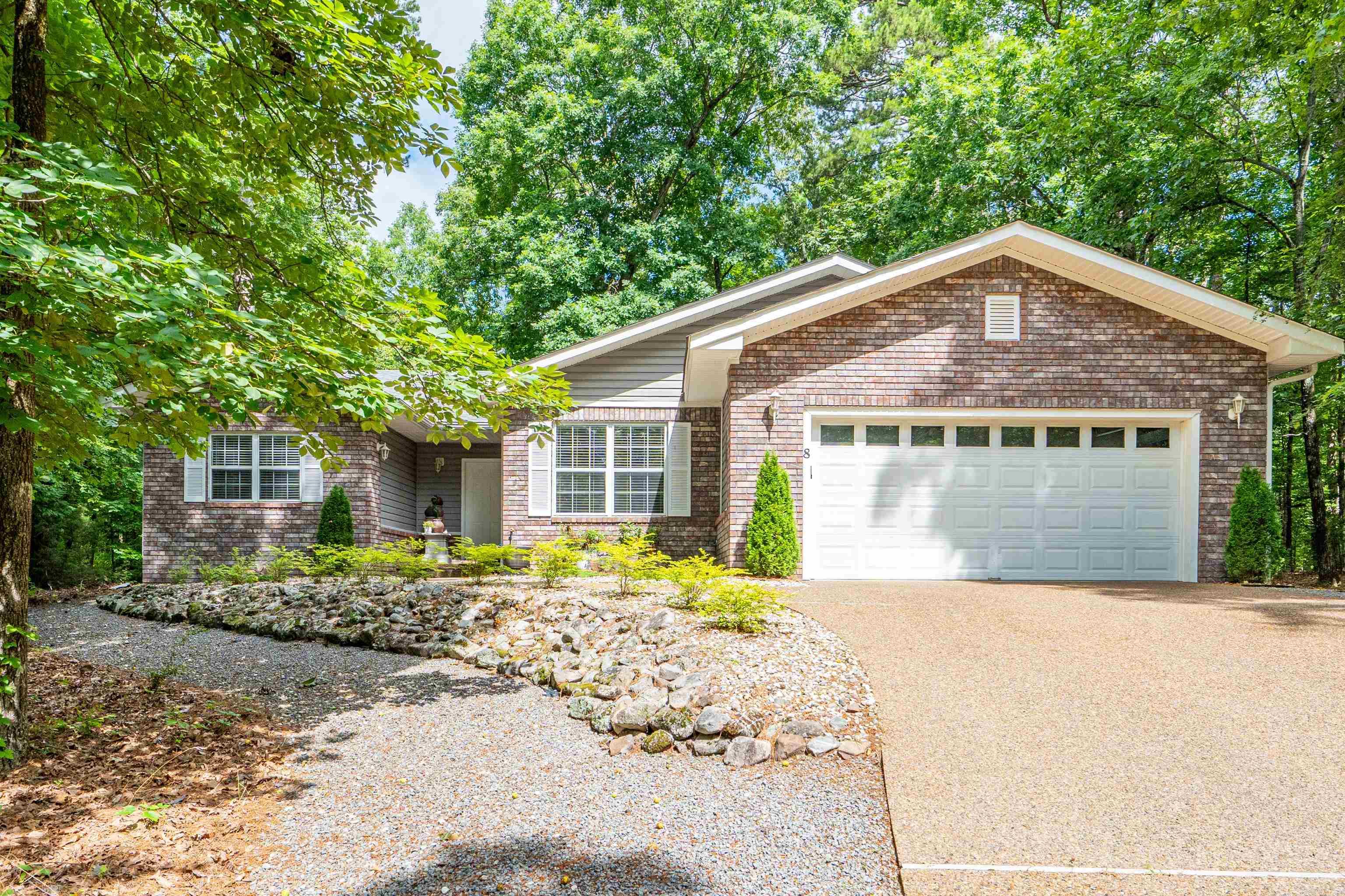 Beautifully updated one-level home offering over 2,000 square feet on a quiet cul-de-sac in the desirable Alicante subdivision of Hot Springs Village. Conveniently located near Lake Pineda, golf, tennis, walking trails and fitness amenities, this home combines comfort, privacy and natural beauty. The thoughtfully designed floor plan features 3 bedrooms, 2 bathrooms, and a versatile bonus room, providing flexible space for a home office, hobby room, or additional living area. The inviting living room is centered around an updated fireplace and flows seamlessly into the dining area and kitchen, creating an ideal space for gathering with family and friends. Recent improvements include new flooring, fresh interior paint throughout, updated landscaping, under-cabinet kitchen lighting, a new stove, a new A/C coil and a remodeled garage with upgraded flooring. Additional enhancements such as sealed driveway, serviced garage door and updated electrical work add to the home's value and appeal. Move-in ready and meticulously maintained, this property offers the perfect opportunity to enjoy the Hot Springs Village lifestyle in a beautifully updated home.