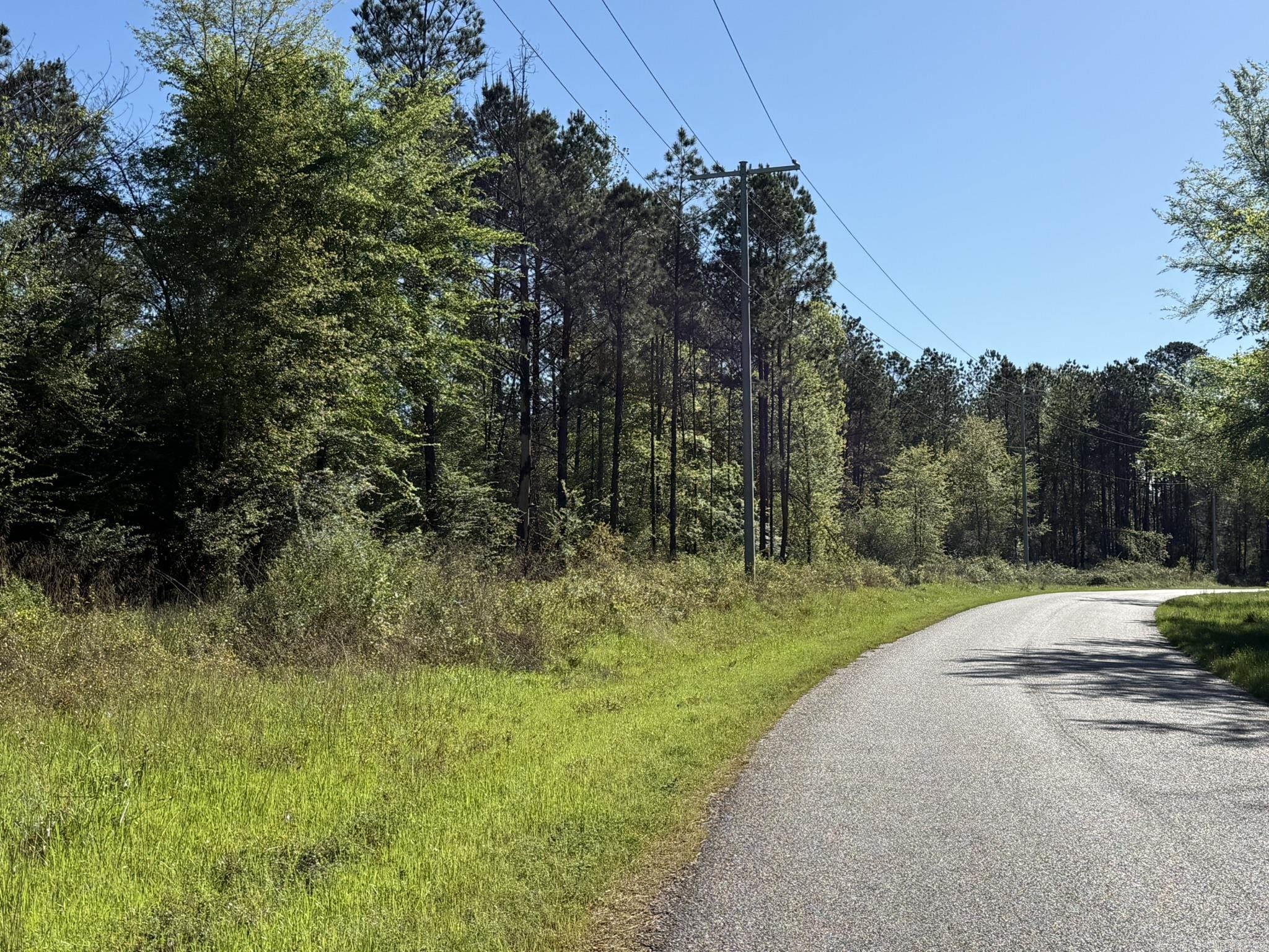 Looking for the perfect location to build your dream home or weekend retreat, this property offers approximately 20 acres boarding the city limits of Murfreesboro, the privacy of rural living with city conveniences. This timber property has been selectively thinned, allowing seclusion with open spaces to build your forever home, cabin or weekend getaway.  Utilities are available at the paved road.  You are minutes from the hustle and bustle of downtown Murfreesboro, the historic Kadoha Indian Village, the Crater of Diamond State Park, the Little Missouri River and the beautiful recreational Lake Greeson.   This property can be subdivided in to two 10 acre tracts.