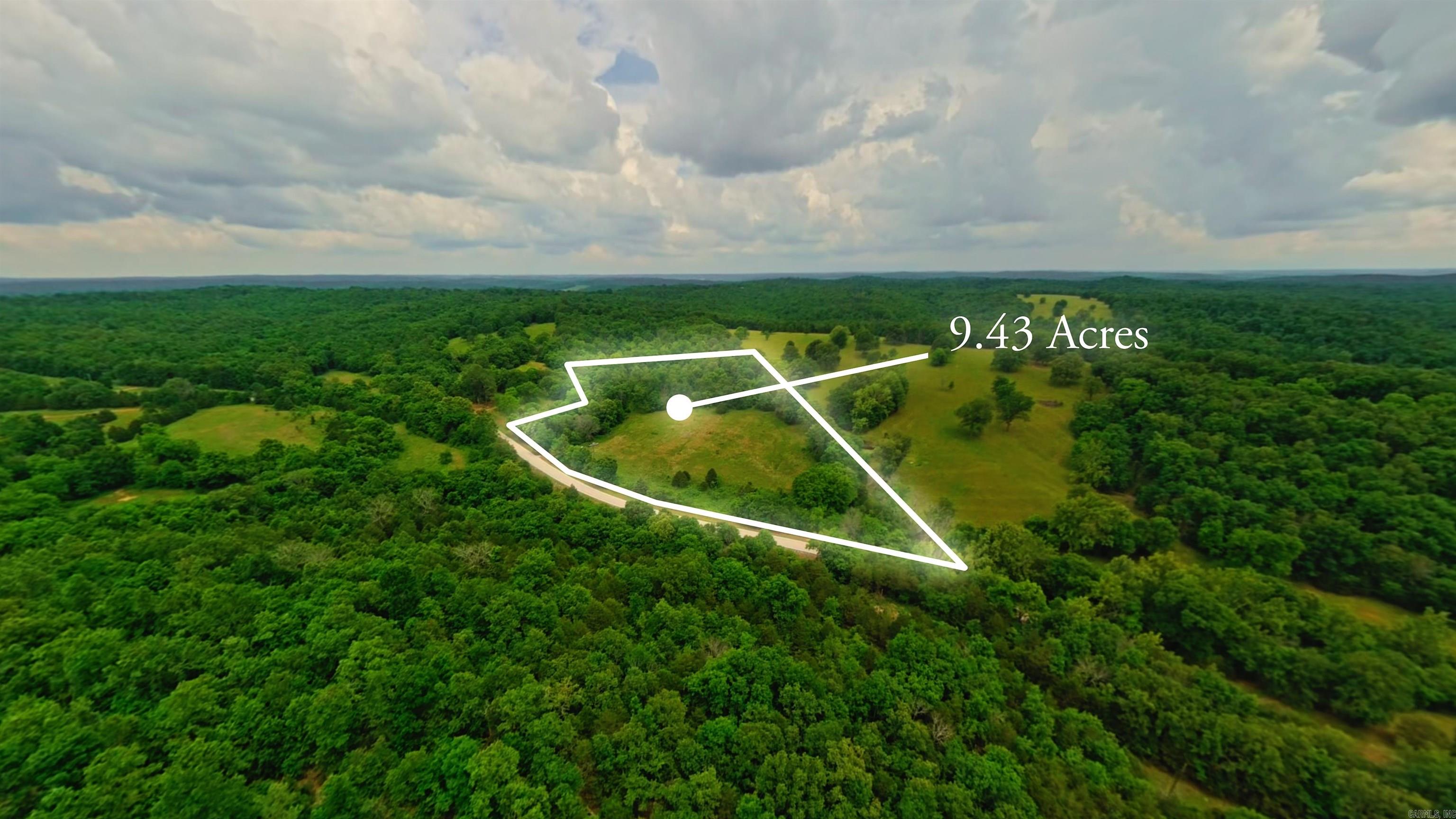 Surveyed Open Land in the Ozarks   Discover the perfect setting for your future home, hobby farm, or country getaway on this 9.47 surveyed acre property located on Highway 289 in Mammoth Spring, Arkansas. Offering highway frontage and electricity available on the property, this tract is ready for your vision.  The land features an excellent mix of open and wooded acreage, with approximately half cleared and half timbered. The open ground has previously been used for hay production and would make excellent pasture for livestock, horses, or a small homestead. The wooded portion provides privacy, shade, and wildlife habitat.  A prime building location sits near the top of the hill, offering an ideal setting for a home with scenic Ozarks views. With plenty of room for gardens, animals, recreation, and outdoor living, this versatile property offers endless possibilities.  Whether you're looking to build, invest, or create your own hobby farm, this beautiful Ozarks acreage is ready for your plans.