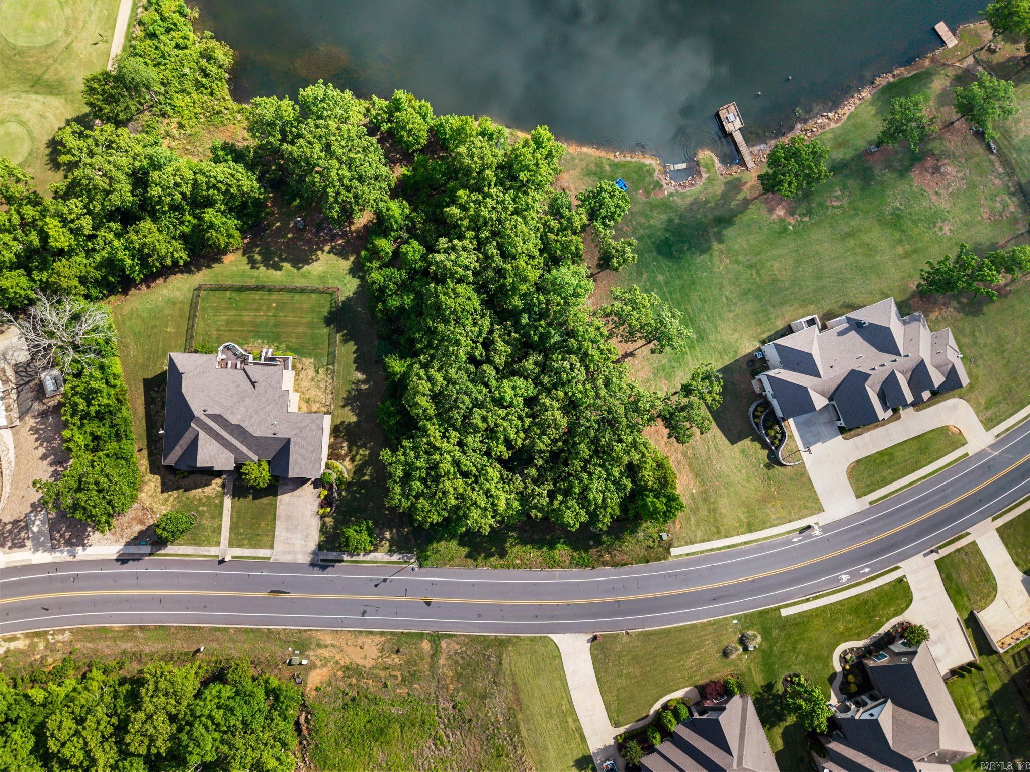 Rare opportunity in a highly sought-after golf course community!  This premier lakefront lot is the last available homesite eligible for a private dock-making it truly one-of-a-kind.  Build your dream home and enjoy direct water access, scenic views, and all the amenities this desirable neighborhood has to offer.  Opportunities like this don't come around twice-secure it before it's gone.  Existing survey.