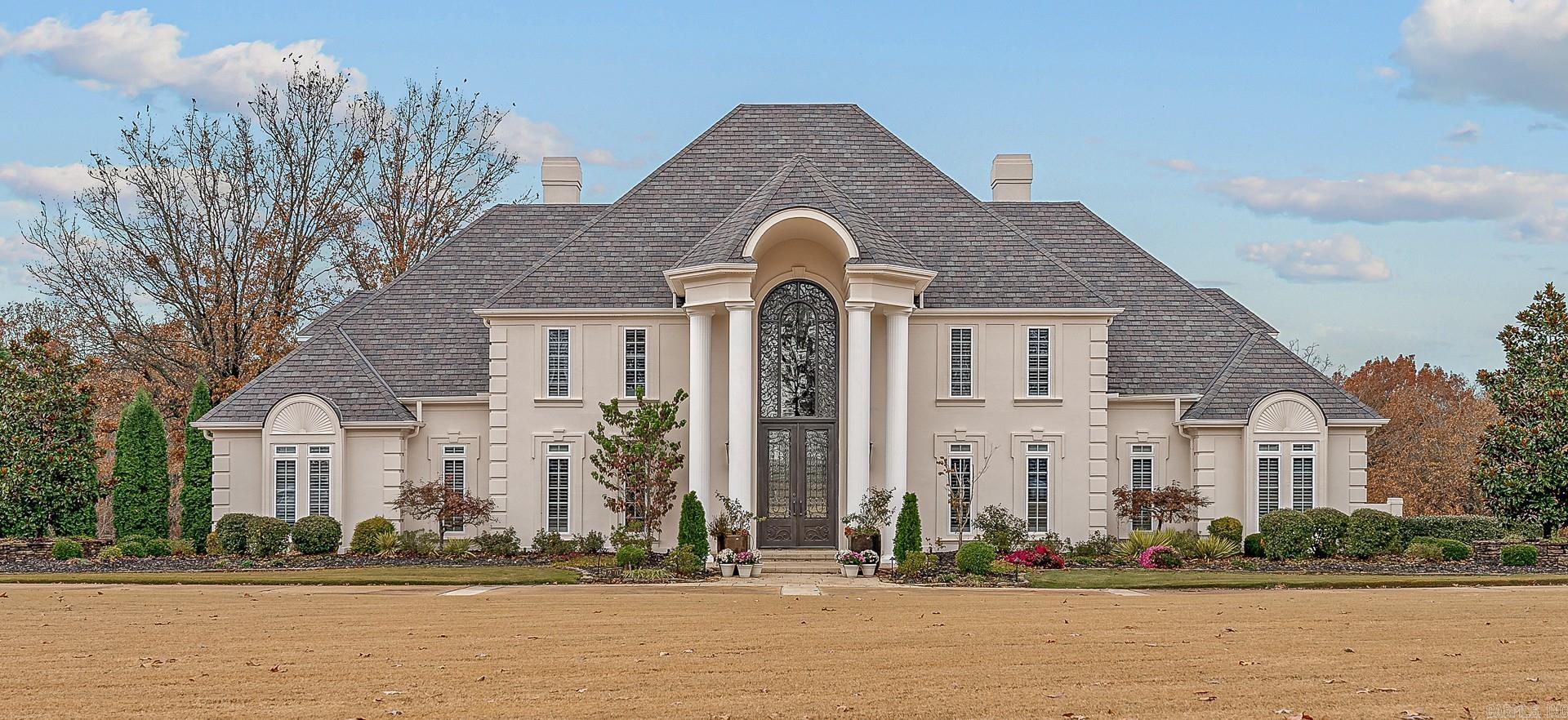 Luxurious estate home on 4 acres in the exclusive RidgePointe Country Club subdivision. The 2-story soaring entrance to the foyer & living room is magnificent. Hardwood flooring with mahogany enlay leads you seamlessly throughout the main level.The chef's kitchen is beautifully & thoughtfully appointed with large island & stunning onyx & mother of pearl backsplash, & Subzero full refrigerator & 2 freezer drawers. Open to the kitchen is a 2nd living area for guests to mingle and continue to share in the kitchen activities. The primary bed & spa bathroom is a private retreat. A 2nd large dining area or sunroom, leads onto the screened in porch with wooden ceilings, gas firepit, and a gas grill, sink, refrigerator.The built-in extra large hot tub with stone fountain accents in this incredibly private setting is so peaceful. You're overlooking 17 acres between you and your nearest & only backdoor neighbor. Upstairs has picturesque views and 2 more living areas, 3 bedrooms, and 2 full bathrooms. Downstairs is a private walk-out suite with kitchenette, full bathroom, with separate private driveway located off the adjoining Sawgrass Street & full, private garage entrance.