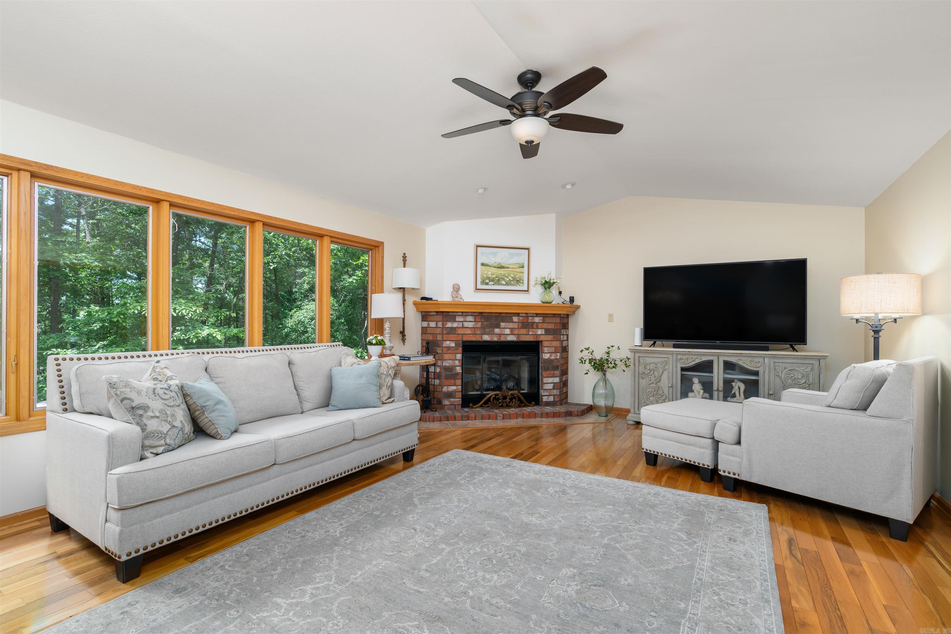 This beauty has 2 decks for all your entertaining needs! With a NEW roof in 2024, gas logs installed in 2025, new PEX lines in 2024, and a new stainless steel sink and faucet...this house is move in ready! The crawlspace is insulated and comes with the dehumidifier. Level driveway and low maintenance yard! Hardwoods floors in most of the house and newer carpet in 2 bedrooms. Gorgeous Roman shades in all the bedrooms and the dining room make this home inviting and cozy. Call today for your showing! AGENTS SEE REMARKS
