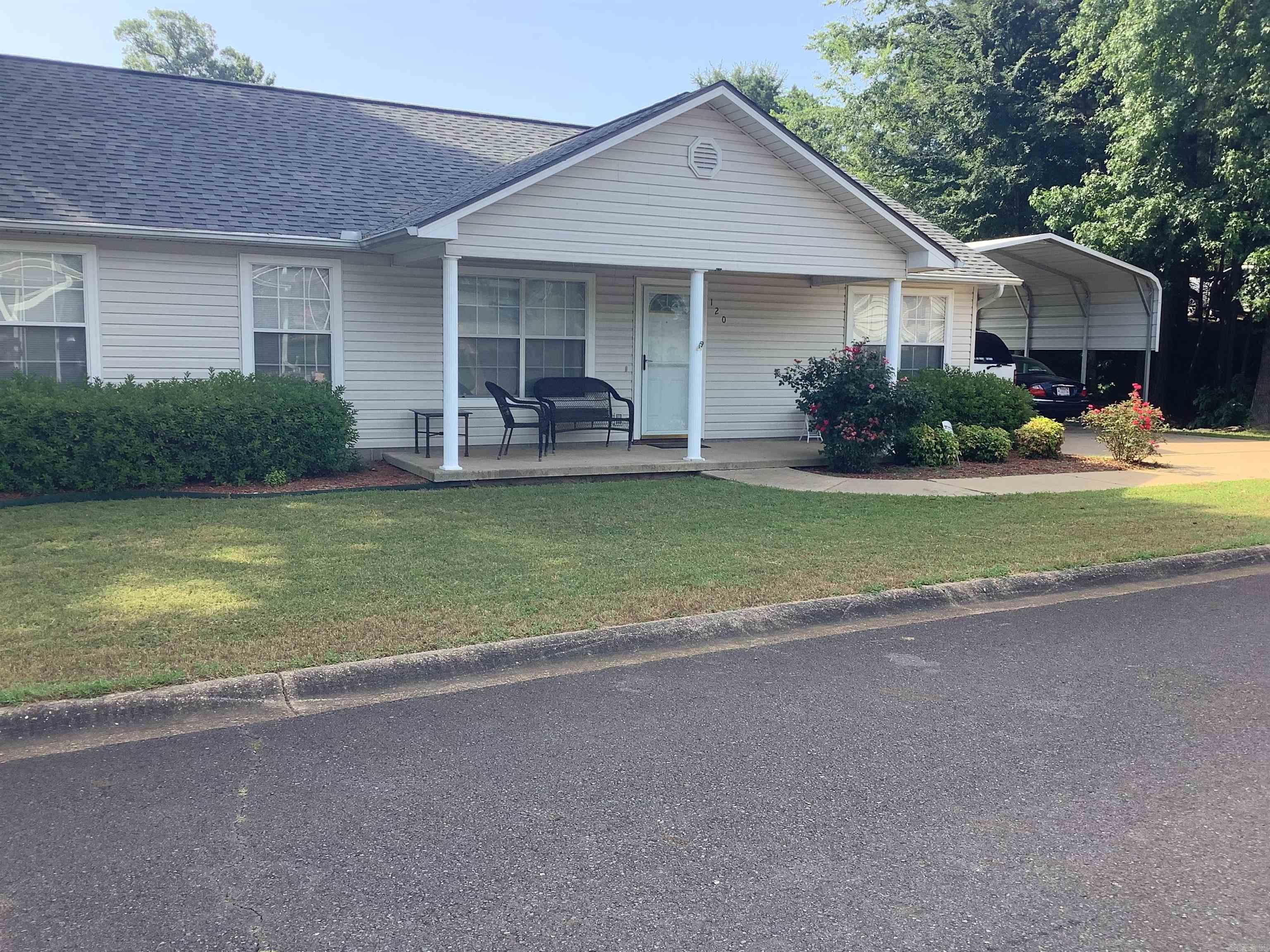 The neatest 2-bedroom, 2-bathroom home in this 55+ community is officially ready for its new owners! With excellent curb appeal, thishome features a charming covered front porch and well-maintained landscaping, including shrubs that line the walkway leading from thecovered two-car carport. Inside, you'll find a thoughtfully designed split-bedroom layout. The oversized primary suite includes a private bath and a spacious walk-in closet. The kitchen offers convenient access to the laundry room, complete with a pantry and utility closet. A door leading from the carport into the kitchen ensures you can stay dry on rainy days. The living and dining areas share an open-concept space with vaulted ceiling. Flooring is carpet in the living room and durable tile flooring in the dining and kitchen area. The backyard is small yet inviting, featuring a terraced layout and a raised flower bed that runs along the back wall. This 55 and older neighborhood also offers a welcoming clubhouse with a full kitchen, pool tables, and an exercise room—perfect for hosting gatherings or attending community events. Storage building coveys. Inherited property. No disclosures