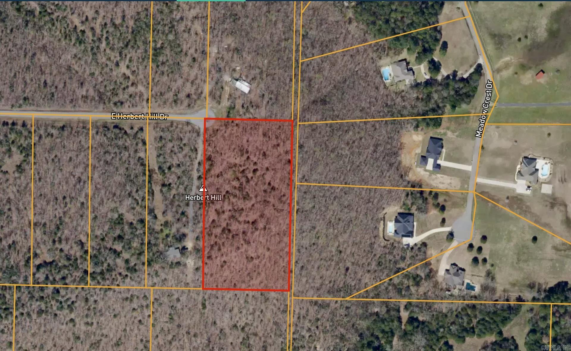Rare opportunity to buy the corner of this historic ridge in the Olmstead community! The private, 5 acre plot has several cleared areas to build your dream home or put it right on the ridge for miles of panoramic views. History buffs will love the remnants of old, dry stone walls and the original 1882 gravestone of the Olmstead family patriarch, who the area is named after (graves relocated to the local cemetery long ago, leaving this really cool piece of history behind!). Property has a Sherwood address but is right inside Faulkner county, so it’s convenient to North Pulaski county, Jacksonville and Mayflower. Located on a cul de sac with utilities at the road. Very little restrictions, so bring your chickens or deer stand!
