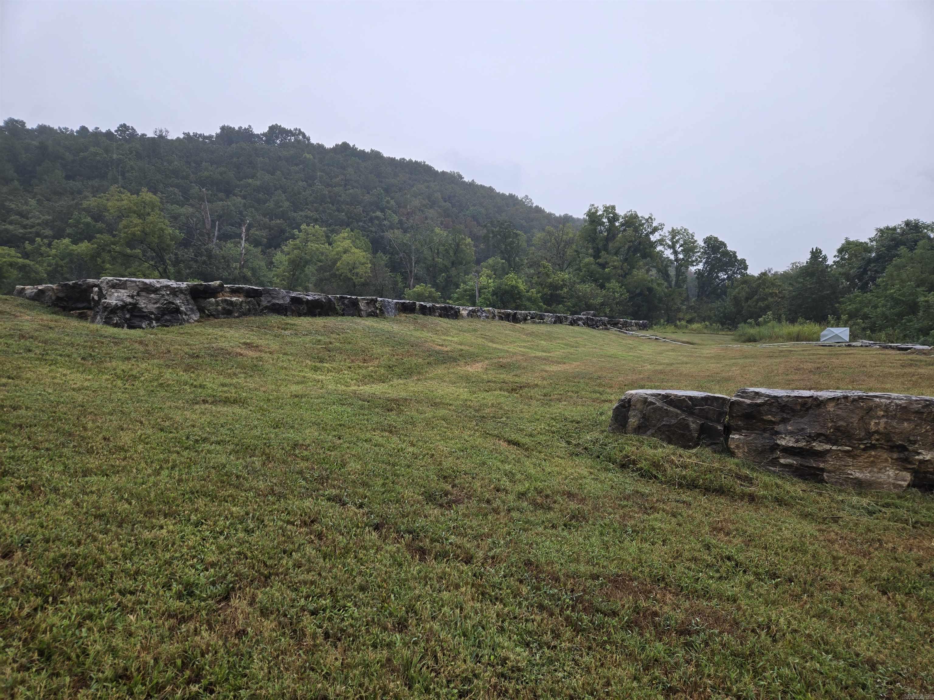 A spectacular 1.25 acres m/l White River lot zoned for Multi family with 227 feet of White River frontage. A 1500 gal septic system has been installed , a well has been drilled and the underground electric makes this a premier property in an upscale gated subdivision located on the banks of the famous White River with a private boat launch and a huge common area for family get togethers. It gets better the adjoining lot 11 is .90 acres m/l  with 150 feet of White River frontage and is also available see MLS # 132233. Combined you'd have 2.15 acres m/l with over 375 feet of river frontage that is zoned Multifamily; that in itself is a rarity . This is a special property in a great neighborhood with world class trout fishing out your door. Zoned for multi-family.