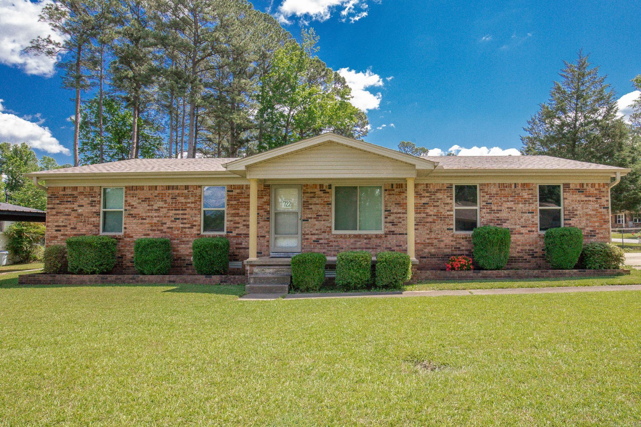 3 bedroom 2  full bath brick home with nice kitchen update & Brazilian teakwood hardwood floors flowing seamlessly through the living room, kitchen & dining area.  The updated kitchen is complete with cabinets extending to the ceiling for added storage and a clean, modern look.  Just off the dining space, you'll love the enclosed sunroom porch- perfect for your morning coffee or afternoon break.  Outside, enjoy a fully fenced yard. Additional highlights: *Spacious separate laundry *Newer Wilson windows (4 yrs ago) *Functional layout with great natural flow *2 Car Garage *Roof only a few years old *Gutters with gutter guards *Refrigerator, washer & dryer convey