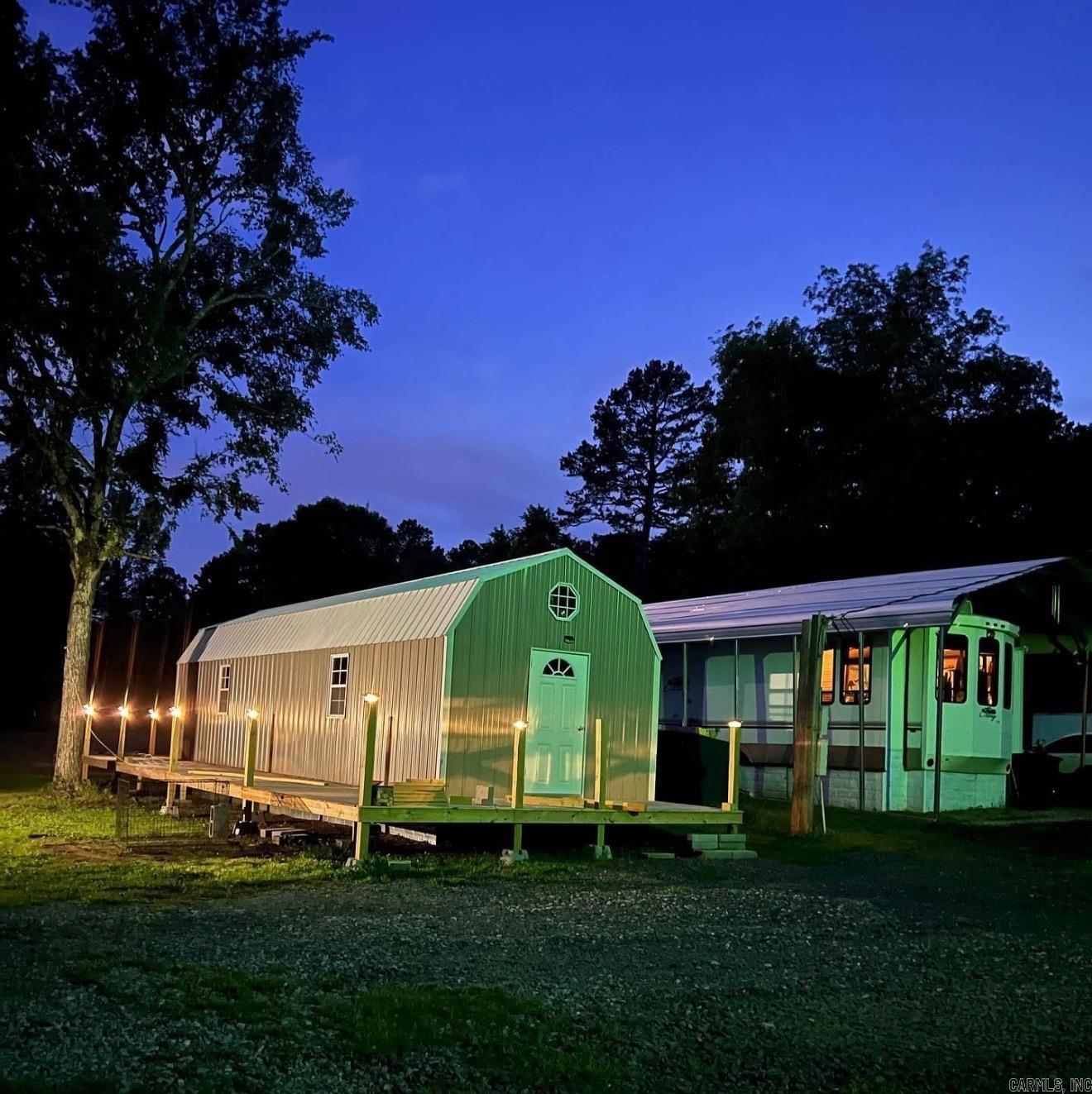 Escape to your own private retreat at 196 Pine Valley Dr in Conway, Arkansas! Nestled on 6.20 scenic acres, this unique rural property with a 2 year old tiny home offers peaceful country living with the convenience of being minutes from Conway shopping, restaurants, schools, and interstate access. Perfect for homebuyers searching for acreage in Conway AR, a homestead, recreational property, Airbnb opportunity, weekend getaway, or multi-use property. A standout feature is the Cedar Creek camper, offering comfortable living space & flexibility for guests, rental income, or full-time country living. Enjoy nature, privacy & outdoor living with a creekside swing, hammocks, lounge area, and room to roam. Property includes security cameras for added peace of mind plus backup propane & generator support for convenience. Many items convey, making this a move-in-ready opportunity including washer/dryer, TVs, table & chairs, loveseat, king memory foam mattress, appliances in tiny house/camper, storage units, outdoor furniture, propane tanks, backup generator & more. Schedule a tour today and see how this property stands out! Agents see remarks.