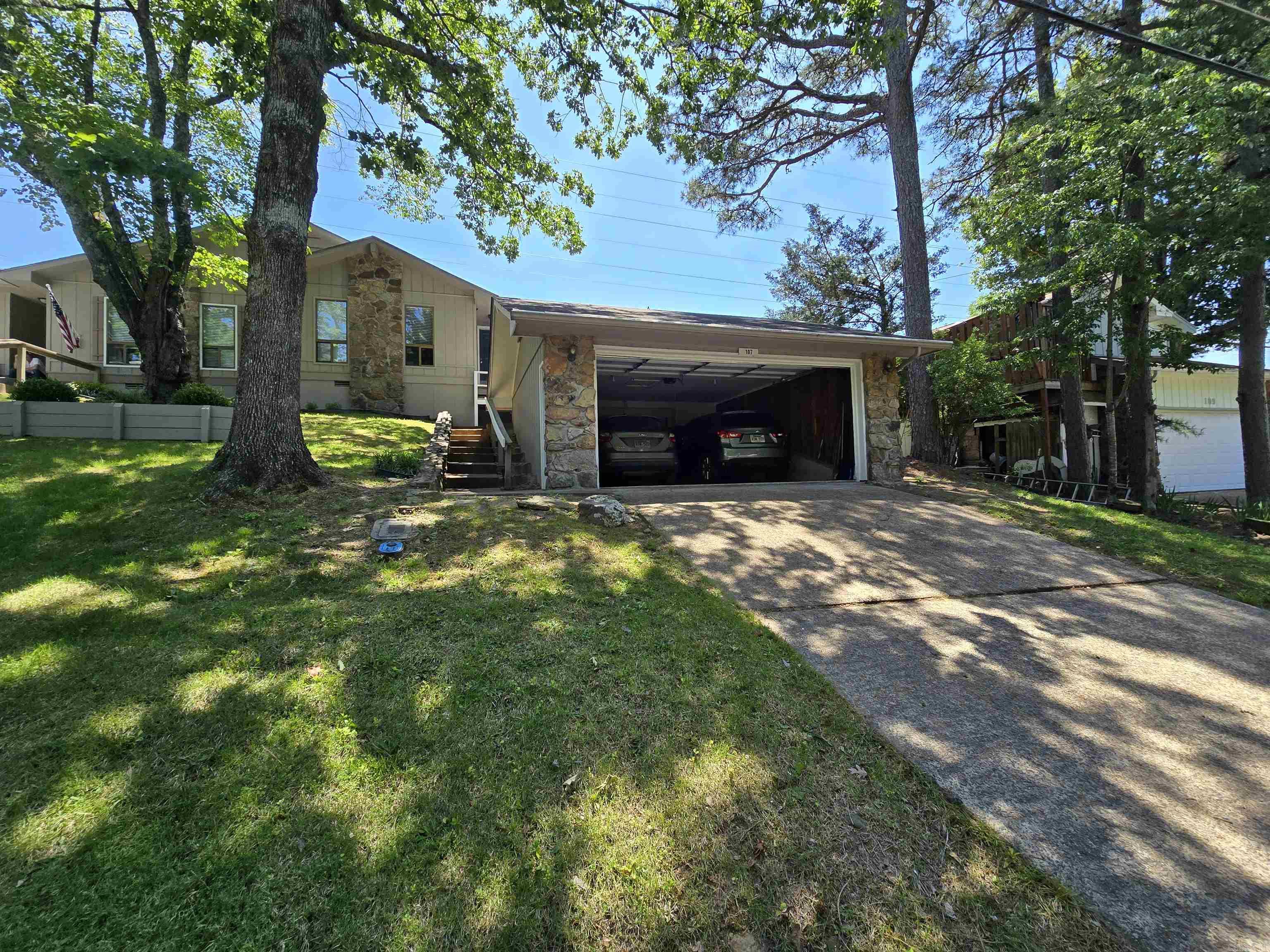 The perfect blasting off point for your Fairfield Bay and Greers Ferry Lake area adventures.  Absolutely clean as a pin and well maintained.  More space and utility than a condo without the condo dues.  With two over-sized bedrooms and two full baths, wood burning fireplace, a large screened back porch, and a two car garage that's just perfect for your lake and trail toys, this home doesn't disappoint!  Situated on a quiet, tree-lined street, with Ed Leamon park right outside the back door, and dining, shopping, music, and festivals within a couple minutes walk in the FFB city center and entertainment district, everything is convenient.  Over 90 miles of interconnecting UTV trails and 20 miles single track and multi-use hiking and biking trials right outside your door allow easy access to the unbelievable beauty of our natural areas.  Not to mention the hundreds of hiking, biking, and UTV trails in the immediate surrounding area and the fun and beauty on Greers Ferry lake.  All of this and much, much more, waiting for you to come and see.  This could be the start of your family's best summer ever!
