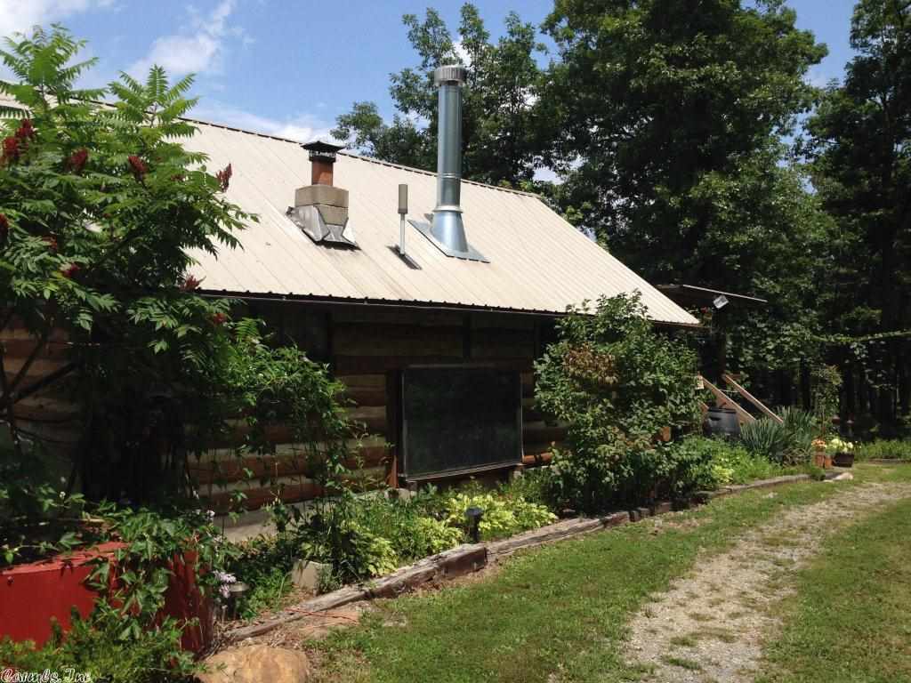 Unique property with fantastic views of the mountains. This property has 3 decks with one deck having a built in fish pond. Home could easily be turned into a 3 bedroom. Property has hot tub and a green house. Lots of storage buildings and garden area. Gazebos and picnic tables. Wood Burning stove and 3 window ac units. Property is a Homestead type of place. A must See!!