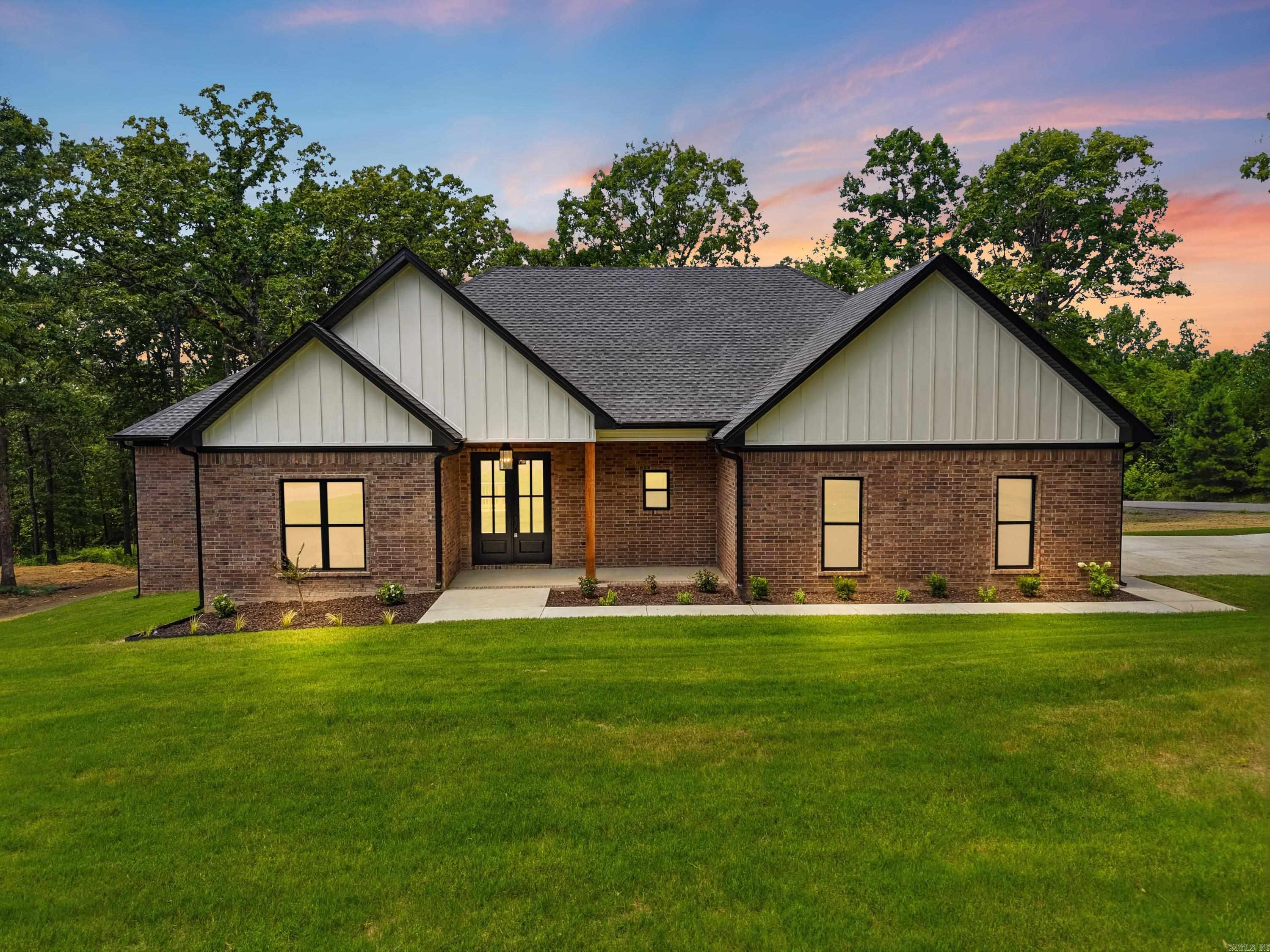 Brand New Construction Near the Lake!   Welcome to your dream home just minutes from Hill Creek Marina! This stunning 4 bedroom, 2.5 bath new build offers the perfect blend of modern style, comfort, and space.  Step inside through the beautiful double front doors and into an inviting open-concept floor plan where the kitchen, living, and dining areas flow seamlessly—perfect for entertaining or everyday living. The home will features vinyl plank flooring throughout, giving it a clean, modern look with easy maintenance.  The spacious primary suite is truly a retreat, offering a large walk-in closet, soaking bathtub, walk-in shower, and his & her vanities—designed for both comfort and functionality.  The kitchen is a standout with a walk-in pantry, providing plenty of storage and convenience for everyday living.  Situated on a beautiful, slightly sloped corner lot, this home offers both charm and curb appeal. Step out onto the back porch overlooking the peaceful property, the perfect place to relax and enjoy the surroundings.  A design board will be attached, giving you a preview of the carefully selected flooring, tile, and color palette that will bring this home together with
