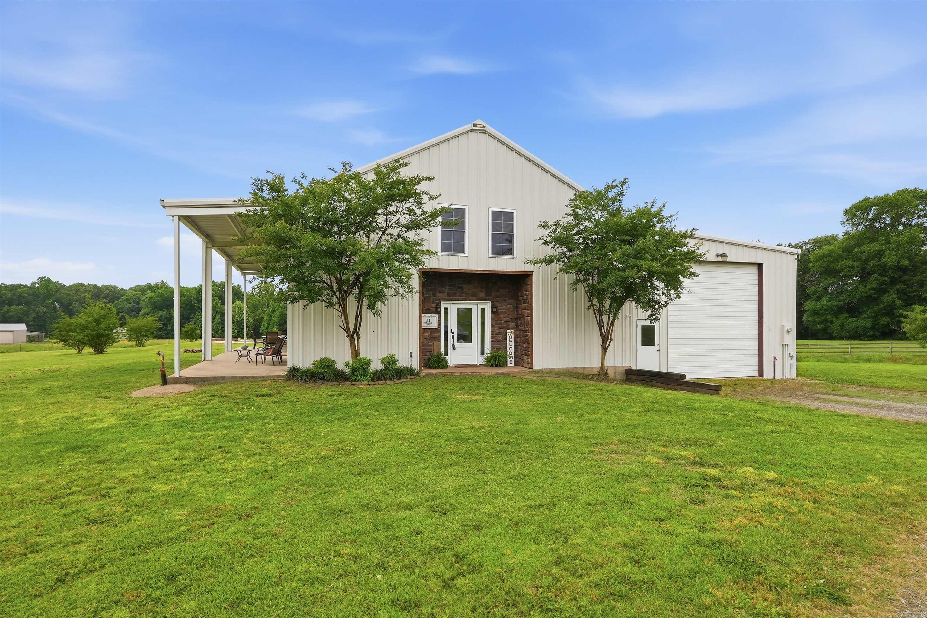Fresh updates, wide-open views, and endless possibilities await! Welcome to this spacious barndominium in the highly desirable Arka Valley Estates. Recently painted in a light, modern exterior color, this spacious 3,810 sq ft home is ready to impress.  Inside you'll find 4 bedrooms, 3.5 baths, a dedicated office space, and an expansive 800+ sq ft. bonus room offering endless possibilities for a game room, gym, media room, or additional living space. The primary suite features a corner air tub and large walk-in closet. Step outside and enjoy true country living with a stunning 60-foot covered porch overlooking wide-open views, a custom in-ground swimming pool, and stocked pond. The 1,500 sq foot garage/shop with electricity is perfect for hobbies, storage, or for your home business.  Located just outside of city limits this property offers, privacy, space, and convenience with close access to the airstrip at the Arkavalley Air Park and without the restrictions of an HOA.