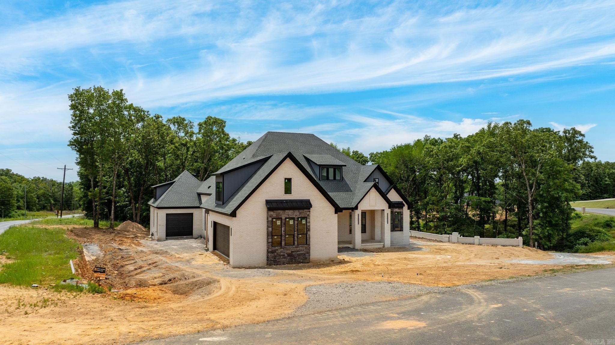 Welcome to an exceptional Highland Hills Subdivision residence, a benchmark in luxury living. This immaculate 4-bed with Ensuite, 4 1/2 bath new construction home is a testament to meticulous craftsmanship. Step inside, and 24-foot ceilings greet you with grandeur, creating an immediate sense of elegance. The gourmet kitchen boasts custom-built cabinets, granite countertops, and a gourmet gas 36" cooktop with a pot filler, catering to culinary enthusiasts. Safety is assured with a FEMA-approved saferoom, and outdoor entertaining is easy with an oversized outdoor porch, that includes outdoor fireplace and custom outdoor kitchen and landscaping. Custom lighting, exquisite trim work add to the luxury. Energy efficiency is paramount, with low-e windows, cellulose insulation, and 18 Seer HVAC with 2 speeds for year-round comfort. The fully insulated three-car garage is both spacious and energy-efficient. Crafted with passion by a renowned VA builder, this home embodies modern luxury living. It's a statement of sophistication and quality that sets a new standard for custom-built homes.