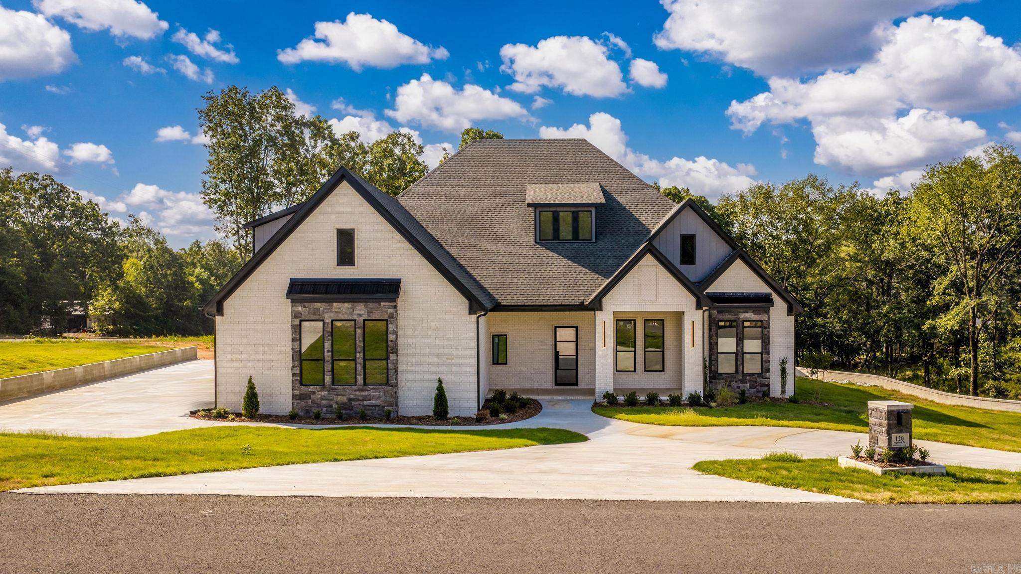 Welcome to an exceptional Highland Hills Subdivision residence, a benchmark in luxury living. This immaculate 4-bed with Ensuite, 4 1/2 bath new construction home is a testament to meticulous craftsmanship. Step inside, and 24-foot ceilings greet you with grandeur, creating an immediate sense of elegance. The gourmet kitchen boasts custom-built cabinets, granite countertops, and a gourmet gas 36" cooktop with a pot filler, catering to culinary enthusiasts. Safety is assured with a FEMA-approved saferoom, and outdoor entertaining is easy with an oversized outdoor porch, that includes outdoor fireplace and custom outdoor kitchen and landscaping. Custom lighting, exquisite trim work add to the luxury. Energy efficiency is paramount, with low-e windows, cellulose insulation, and 18 Seer HVAC with 2 speeds for year-round comfort. The fully insulated three-car garage is both spacious and energy-efficient. Crafted with passion by a renowned VA builder, this home embodies modern luxury living. It's a statement of sophistication and quality that sets a new standard for custom-built homes.