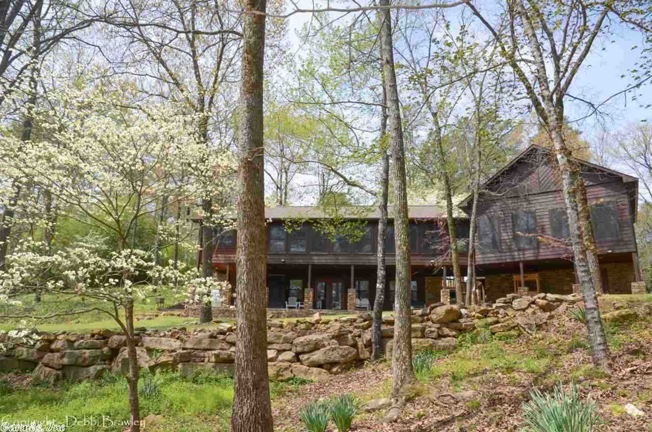 Gorgeous & rare–lakefront home on 5 ac. in a beautiful park-like setting. Excellent white line, newly remodeled kitchen with new granite counter tops, huge walk-in pantry, a rustic tongue & groove entertainment/trophy room with real bar, play Frisbee, volleyball, or just enjoy the natural outdoor setting on this 3 acre lot if you’ve always wanted your family to bring their motorhome, there is even room for that.  This lakefront property is what most people dream about in a lakefront retreat-it can be yours!