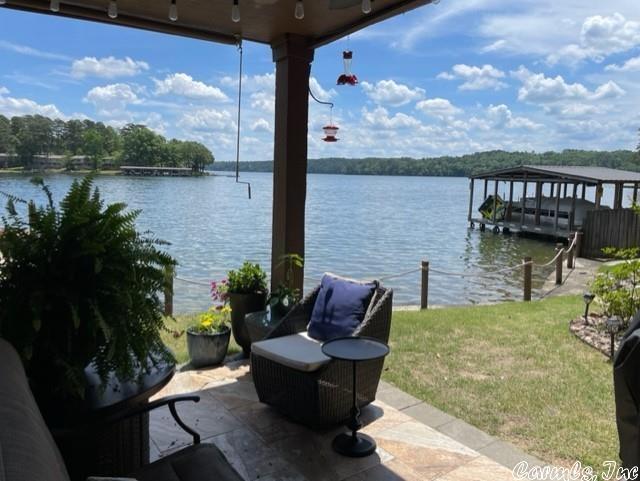TOTALLY UPDATED, PERFECT VIEW OF LAKE HAMILTON, PERFECT LOCATION OFF CENTRAL AVENUE CLOSE TO OAKLAWN AND SHOPPING! 2 BR, 2 BA situated in complex so that you have 2 choices for entry... a few steps to the front door or walk in level to the patio! Established community with gated entrance, pool, and NO RENTALS allowed! Everything is new... paint, flooring, cabinets, fixtures, countertops, etc. No carpet.  There is also a wine fridge, glass rinser, and Hunter Douglas Honeycomb Shades. COVERED BOAT SLIP WITH LIFT.  Condo faces east to enjoy beautiful sunrises.