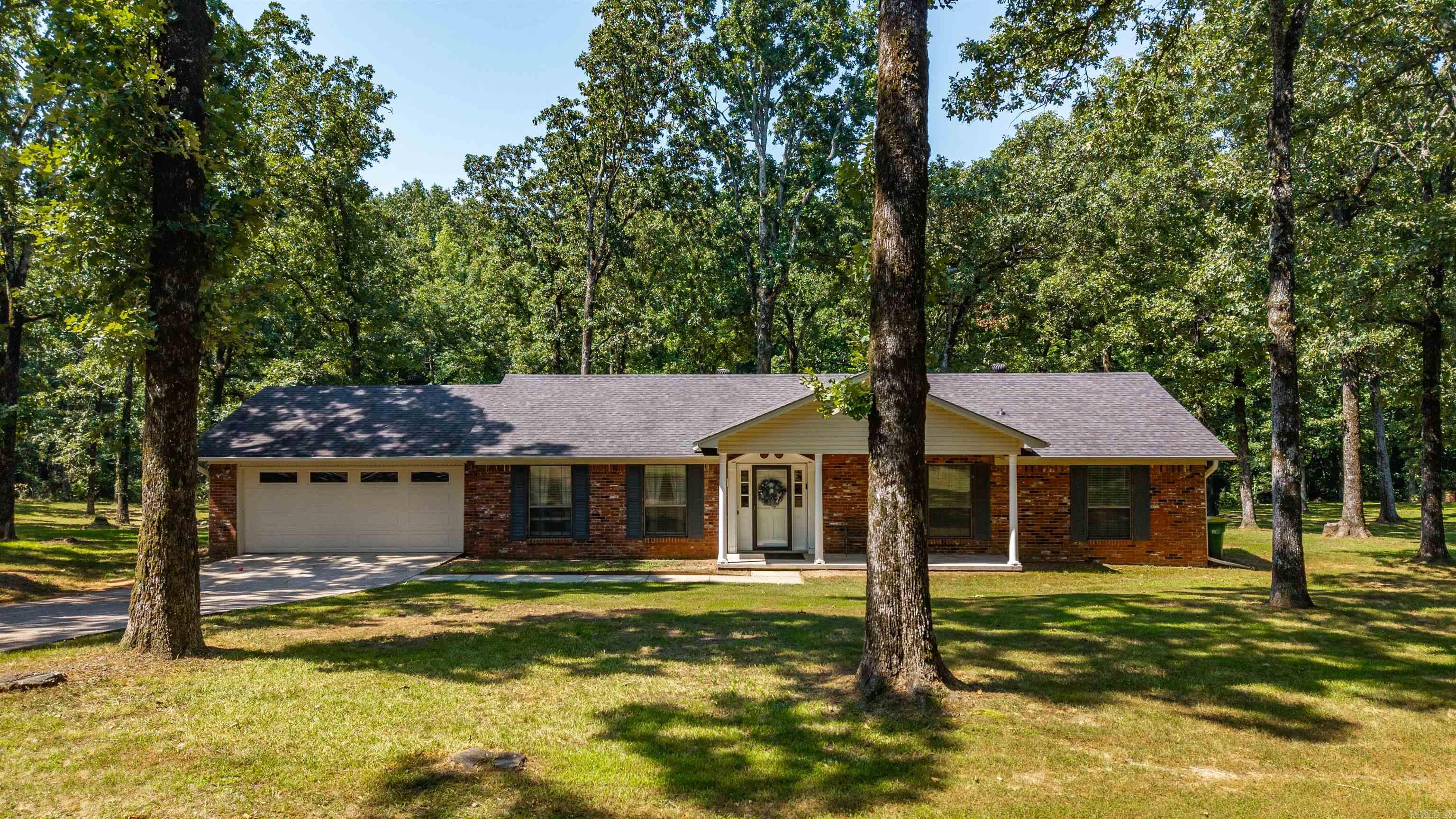 Come smell the clean air & enjoy a park-like setting on your very private 3.67 gorgeous acres far enough out to have peace & quiet but near enough to get whatever you need in under 10 minutes in either Maumelle or North Little Rock. There is enough room to have all the things you want but not too big to feel overwhelmed when it comes to maintaining. Most people will fly right by this seemingly hidden driveway entrance to your little gem and that's quite alright. Most Importantly, you can do whatever whatever you like on your acreage since it's not in a subdivision. If you have to go inside, there is plenty of space for friends & family alike, great storage and two Gorgeous recently updated bathrooms. It's a great home for parties and there's a large deck outside that is both covered & open with a large view of your beautiful peaceful acreage. You've got to come see it for yourself and you'll be hooked.