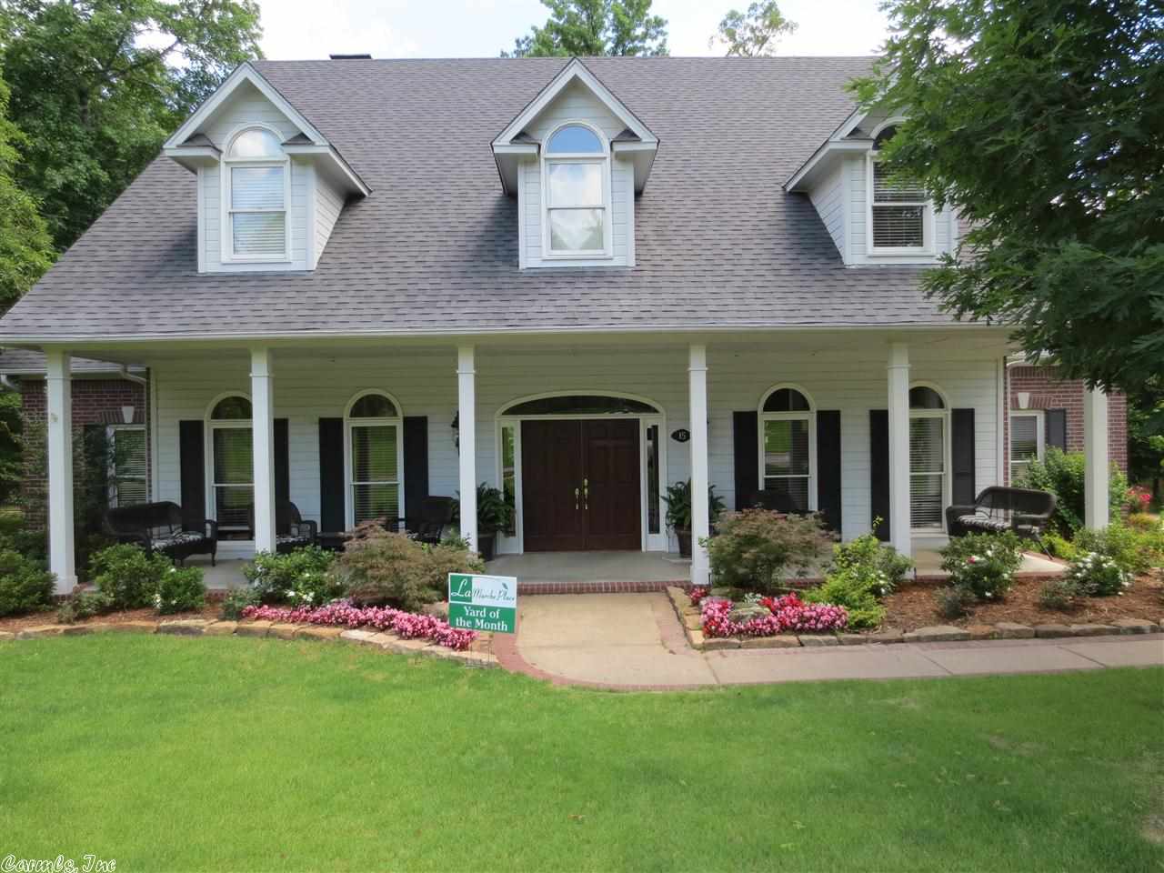 Fantastic Chenal Valley home on large flat lot. Backs to greenbelt. Gorgeous entry with curved staircase. Covered front porch and back.  Hardwood floors throughout main level in living areas. Front living area or office. Family room w/wbfp opens to kitchen. Slab granite, lots of seating and large breakfast table area.  Master Main with small office area. Up has 3 bedrooms, workout rm, bonus room and sitting area w/bookshelves off stairs.  Two car garage but has third bay for storage/workshop.  Come see!