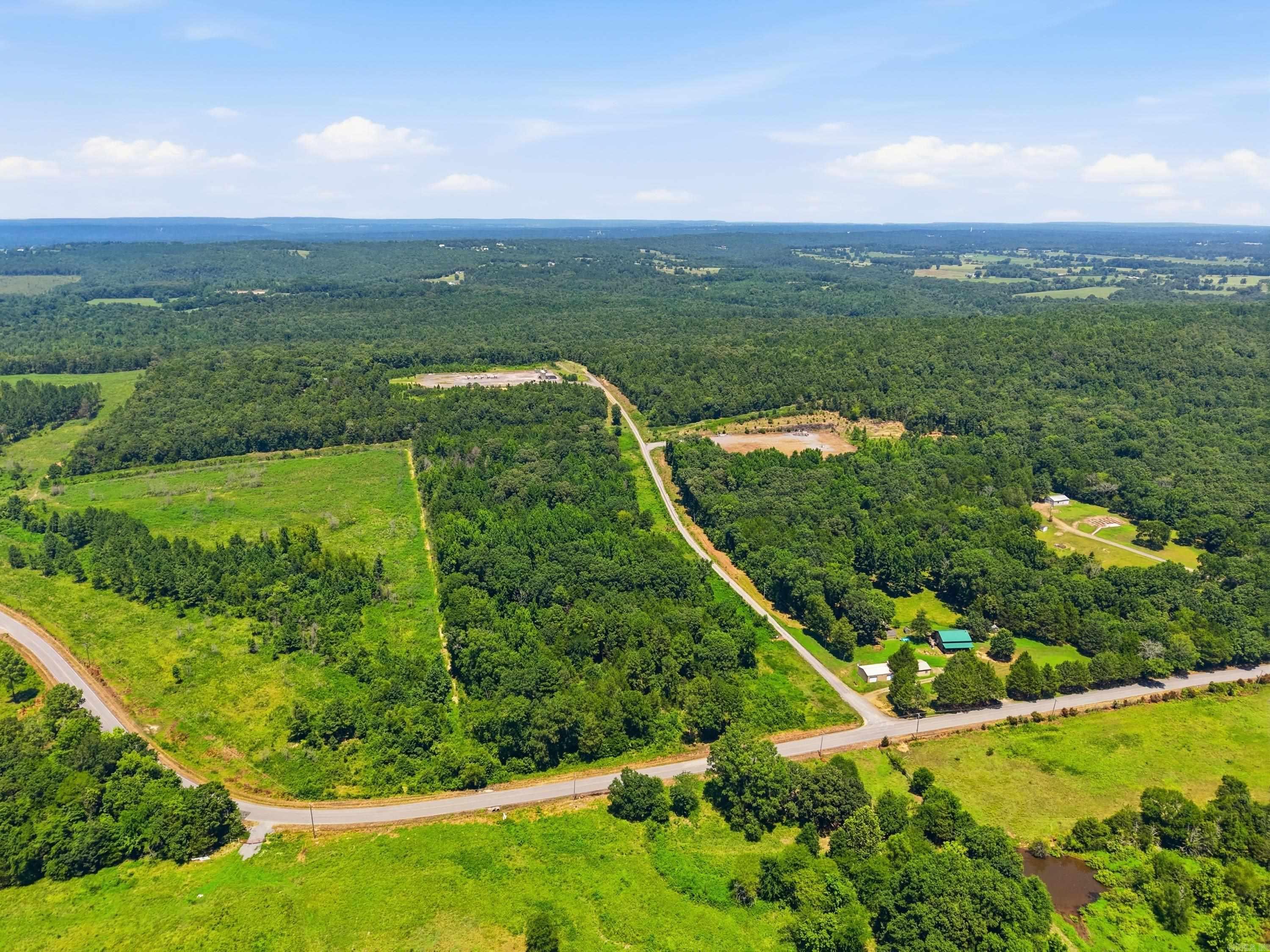 70 plus acres of beautiful land located in the highly desirable Greenbrier Arkansas School District, surrounded by an area of newly constructed homes and growing development. This versatile acreage offers so many possibilities including an elevated hilltop with scenic views and added privacy. Paved road access extends along West Republican Rd for the front portion of the property, and utilities are available at the road (not currently on site). Whether you’re looking to build your dream home, establish a farm or ranch, or invest in land with strong future potential, this property offers an exceptional opportunity. Land with this much potential doesn’t come along often, so schedule a private tour today! Agents see remarks.