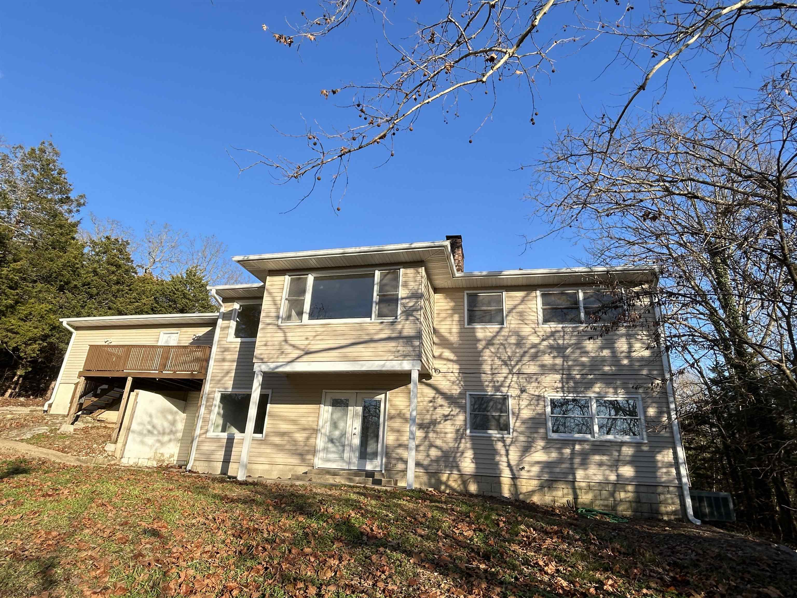 Spacious & Newly Renovated Home – Ideal for a Large Family or In-Law Quarters! Horseshoe Bend, AR Don’t miss this beautifully remodeled, move-in ready home, perfect for a large family or potential in-law quarters! Nestled on a quiet, wooded street, this home offers both privacy and convenience—just minutes from Turkey Mountain Golf Course and Crown Lake. Recent Updates Include:Fresh interior paint throughout Refinished wood floors, fully renovated kitchen with new cabinets, countertops, & farmhouse sink Updated bathrooms with new vanities, all-new LED lighting,new front deck & updated guttering. Roof is approximately 5 years old Plenty of Space – Two Living Areas! Lower level features a private entrance | Cozy wood-burning fireplace with heatalator & gas radiant wall heaters in the upper and lower level that are energy efficient and heat the whole house. The dual HVAC system, though aged, is functional and in working order and serviced by HVAC professional.