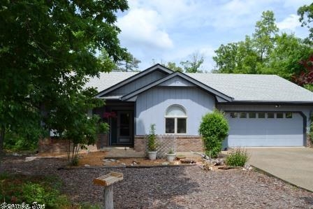 A quiet cul de sac in Mid-Village location near the Coronado Center and Lake Coronado.  The one-level home boasts a sunny Arkansas room great for indoor plants.  Split bedroom floor plan with two bedrooms on the street side and owner's suite facing the rear deck.  Walk out through the french doors to the freshly painted deck area and hot tub to enjoy the wooded view. Water heater replaced June 2014. Seller will credit Buyer a $700 flooring allowance on an acceptable offer.
