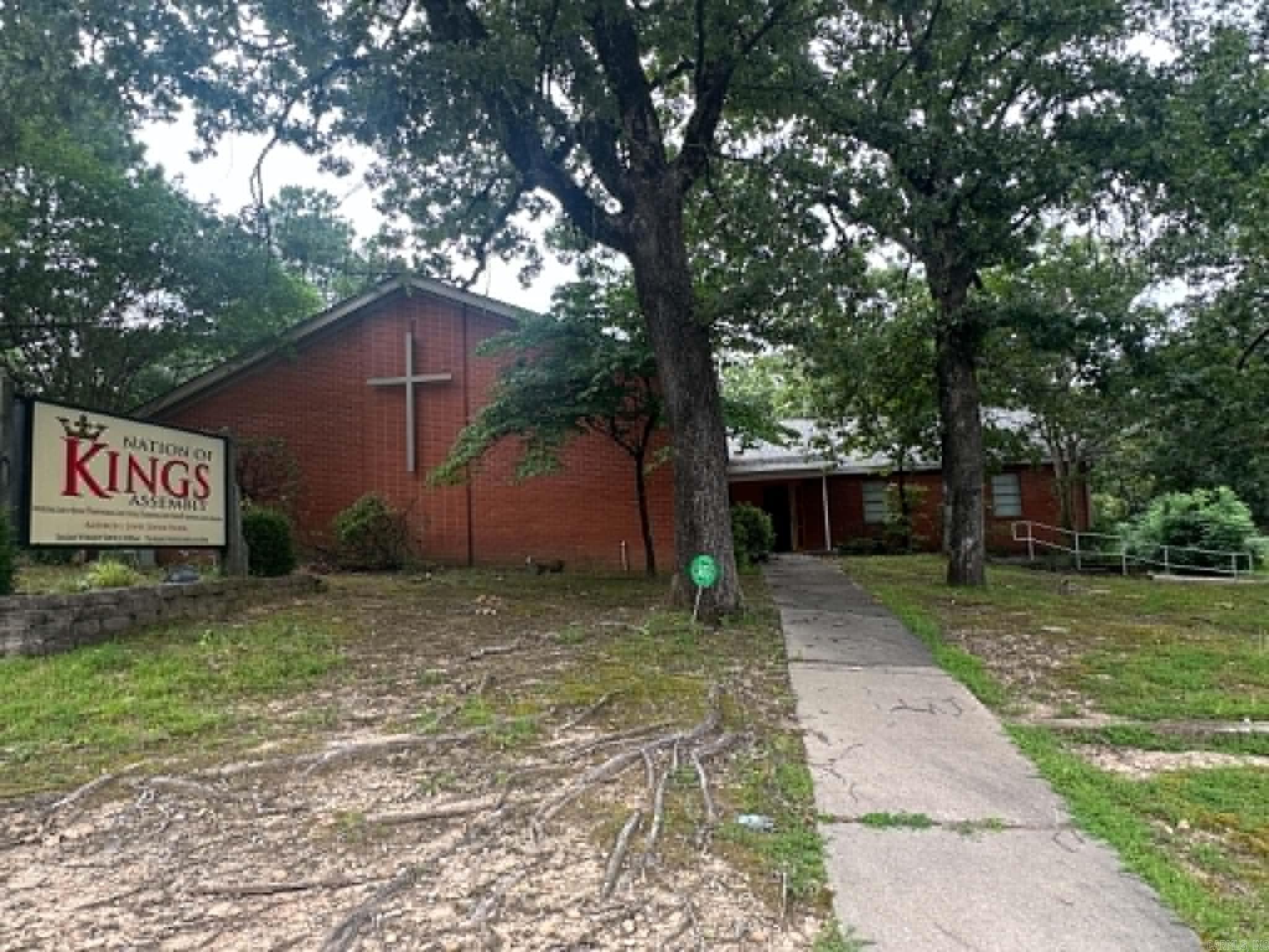 Approximately 4,200 SF brick church facility offering excellent flexibility for continued ministry use or conversion to office, nonprofit, educational, counseling, daycare, or other approved commercial use. Property features a moderate-sized sanctuary with stage area, two classrooms, business office, pastor’s study, multi-purpose room, kitchen, and two restrooms. Building is wired for sound and additional TVs/media expansion, providing added functionality for worship services, presentations, training, or business operations.  Exterior features include mature trees, established signage, accessible entry points, on-site parking, and a deck area. Roof was replaced in 2024. Rear HVAC unit is approximately 6 years old. Property also includes two side HVAC units, with one unit needing replacement.  Functional layout with multiple-use possibilities for an owner-user, ministry, or investor seeking adaptable commercial space. Property is being sold AS IS, WHERE IS. Seller will make no repairs or warranties. Buyer to verify square footage, zoning, condition, and intended use.