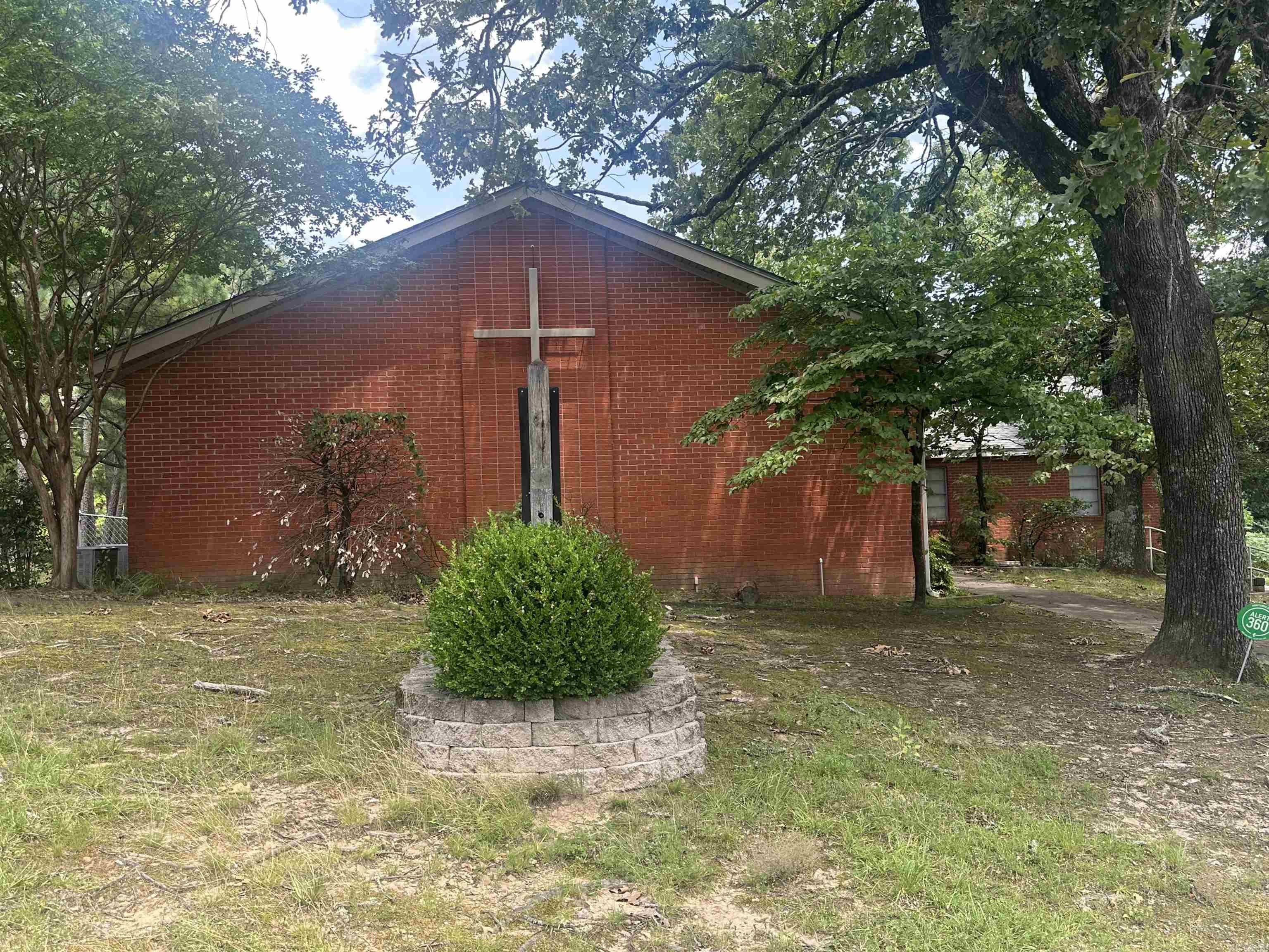 Approximately 4,200 SF brick church facility offering excellent flexibility for continued ministry use or conversion to office, nonprofit, educational, counseling, daycare, or other approved commercial use. Property features a moderate-sized sanctuary with stage area, two classrooms, business office, pastor’s study, multi-purpose room, kitchen, and two restrooms. Building is wired for sound and additional TVs/media expansion, providing added functionality for worship services, presentations, training, or business operations.  Exterior features include mature trees, established signage, accessible entry points, on-site parking, and a deck area. Roof was replaced in 2024. Rear HVAC unit is approximately 6 years old. Property also includes two side HVAC units.  Functional layout with multiple-use possibilities for an owner-user, ministry, or investor seeking adaptable commercial space. Property is being sold AS IS, WHERE IS. Seller will make no repairs or warranties. Buyer to verify square footage, zoning, condition, and intended use.