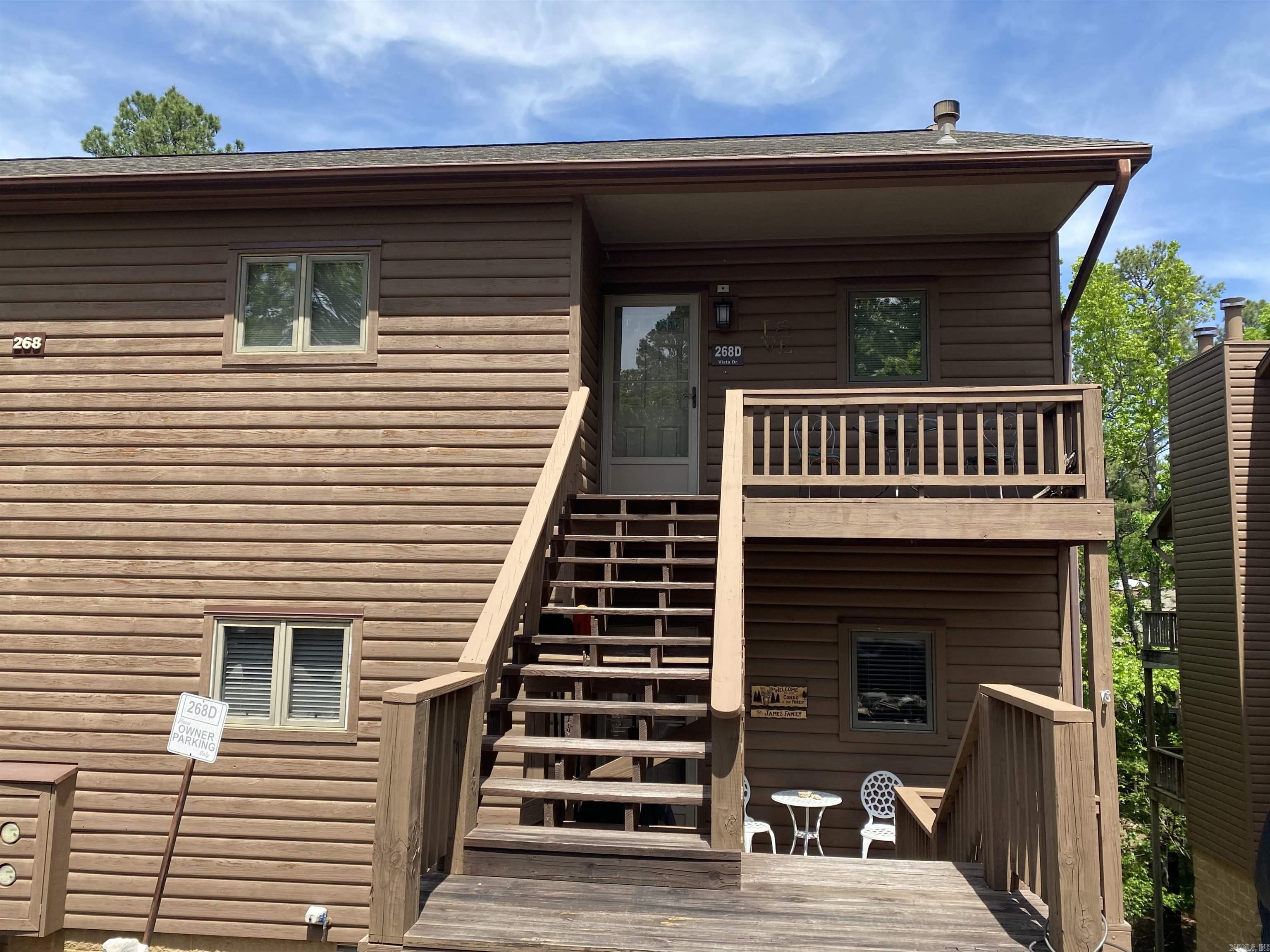 This is what you have been waiting for! 2 bedrooms, 2 baths, approx. 1024 sq ft, in this upper-level condo located in the Mountain Harbor community on beautiful Lake Ouachita.  The living area features a vaulted ceiling, wood burning fireplace and abundant natural light creating a spacious and airy feel. Step outside to the large, fully covered back deck, which is perfect for relaxing year-round, entertaining guests or just enjoying the natural setting.  Not all condos this size have this large, fully covered deck! Priced right to leave room for you to make any updates you may or may not want.  Don't miss this incredible opportunity to have your very own Lake Ouachita getaway!